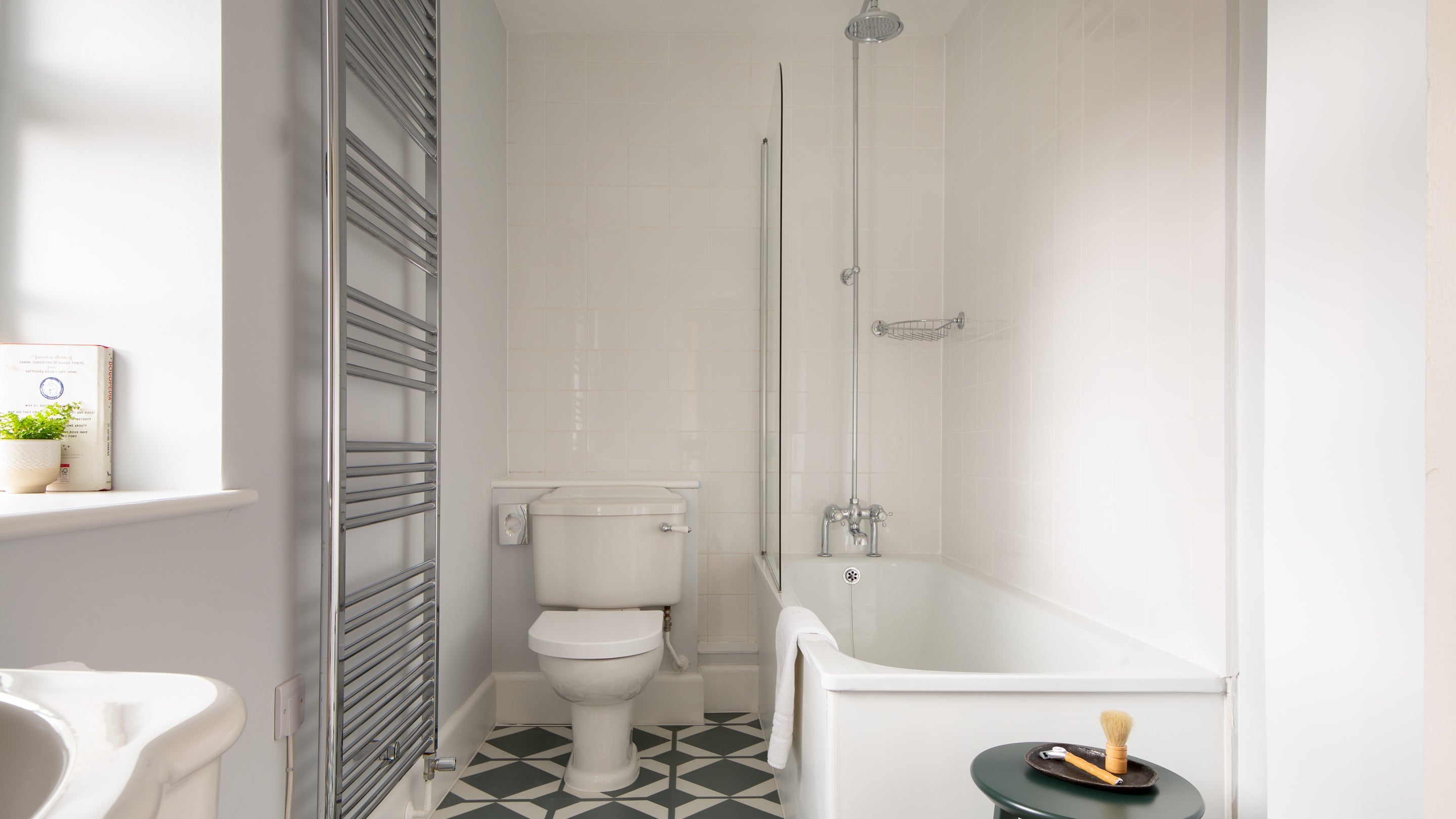 The first floor bathroom with shower over bath at The Weir Garden Cottage, Herefordshire