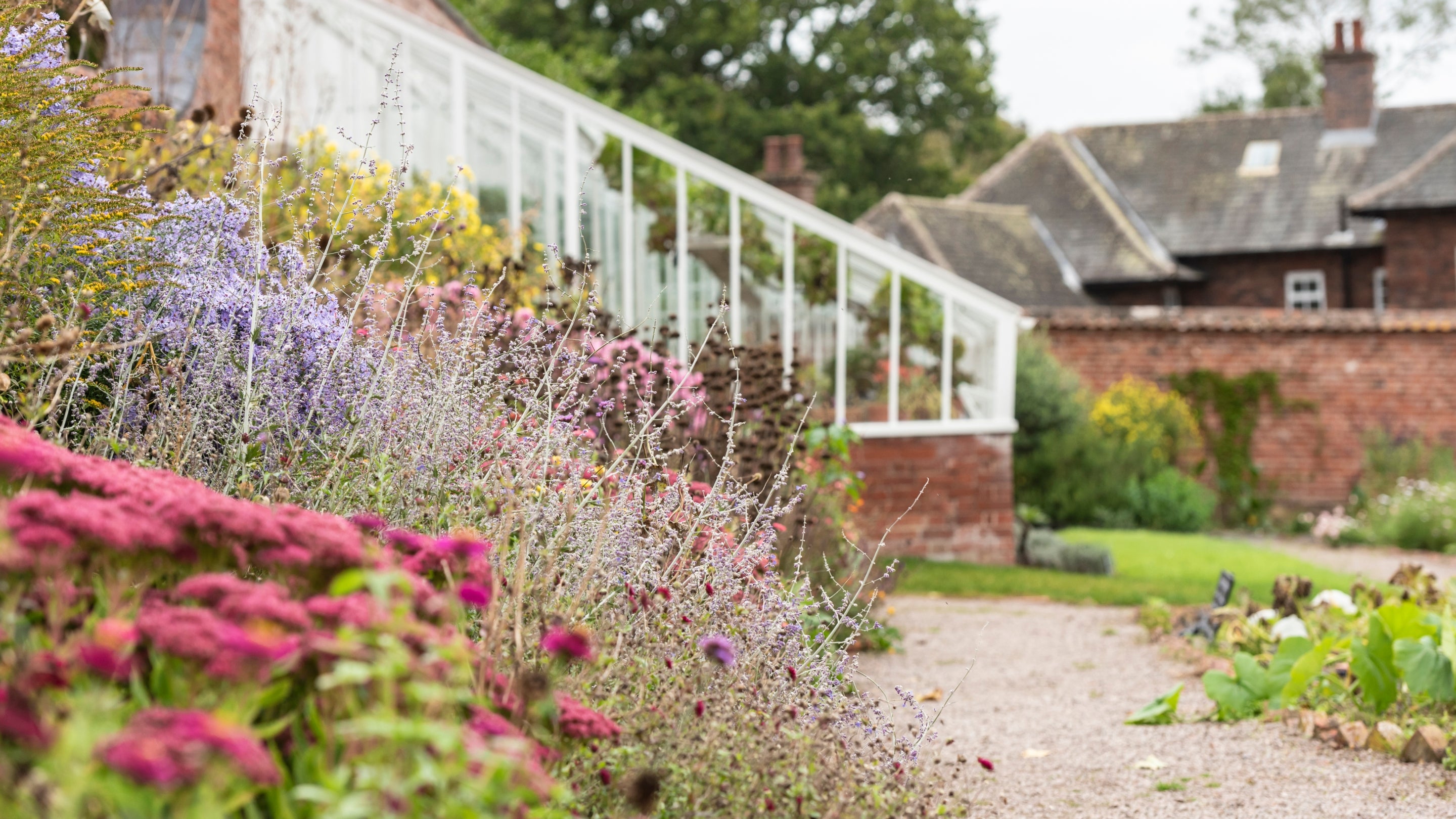 A view of the Weir Garden Cottage during restoration from the Weir Garden, Herefordshire