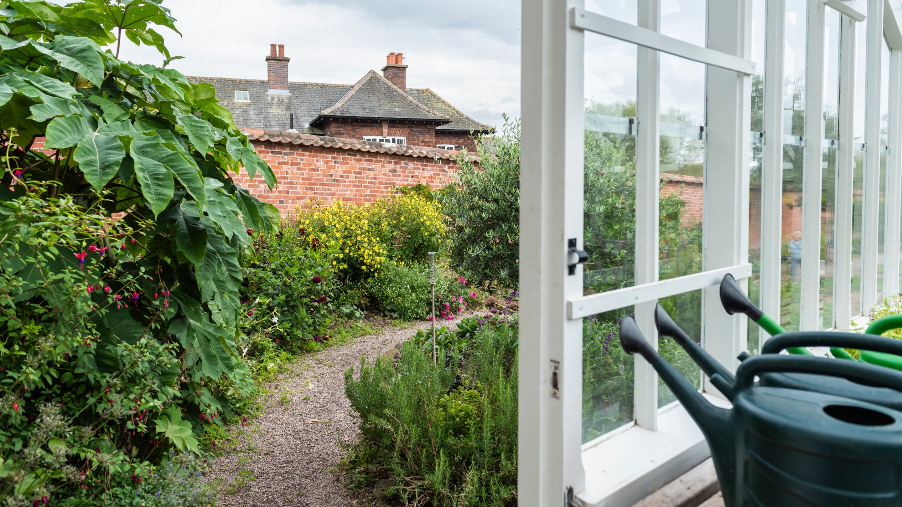 A view of The Weir Garden Cottage during restoration from the Weir Garden, Herefordshire