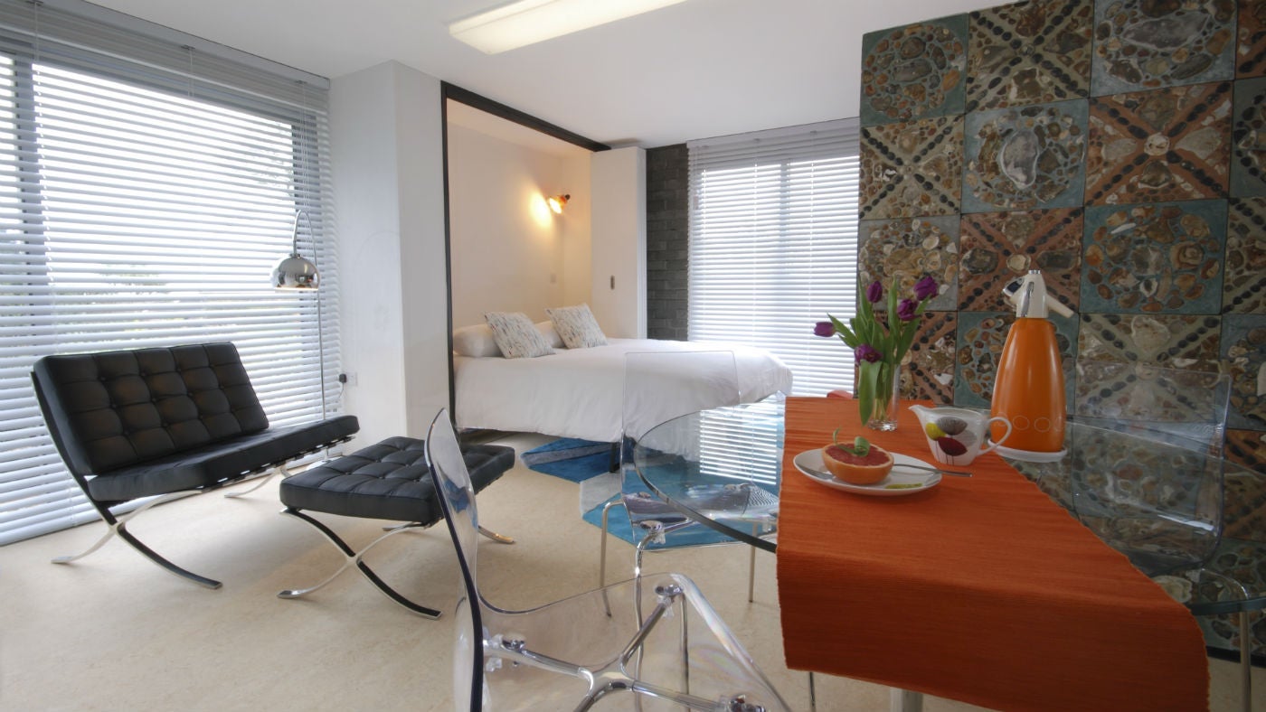 The open plan bedroom and dining area at Little Chert, St Lawrence, Isle of Wight