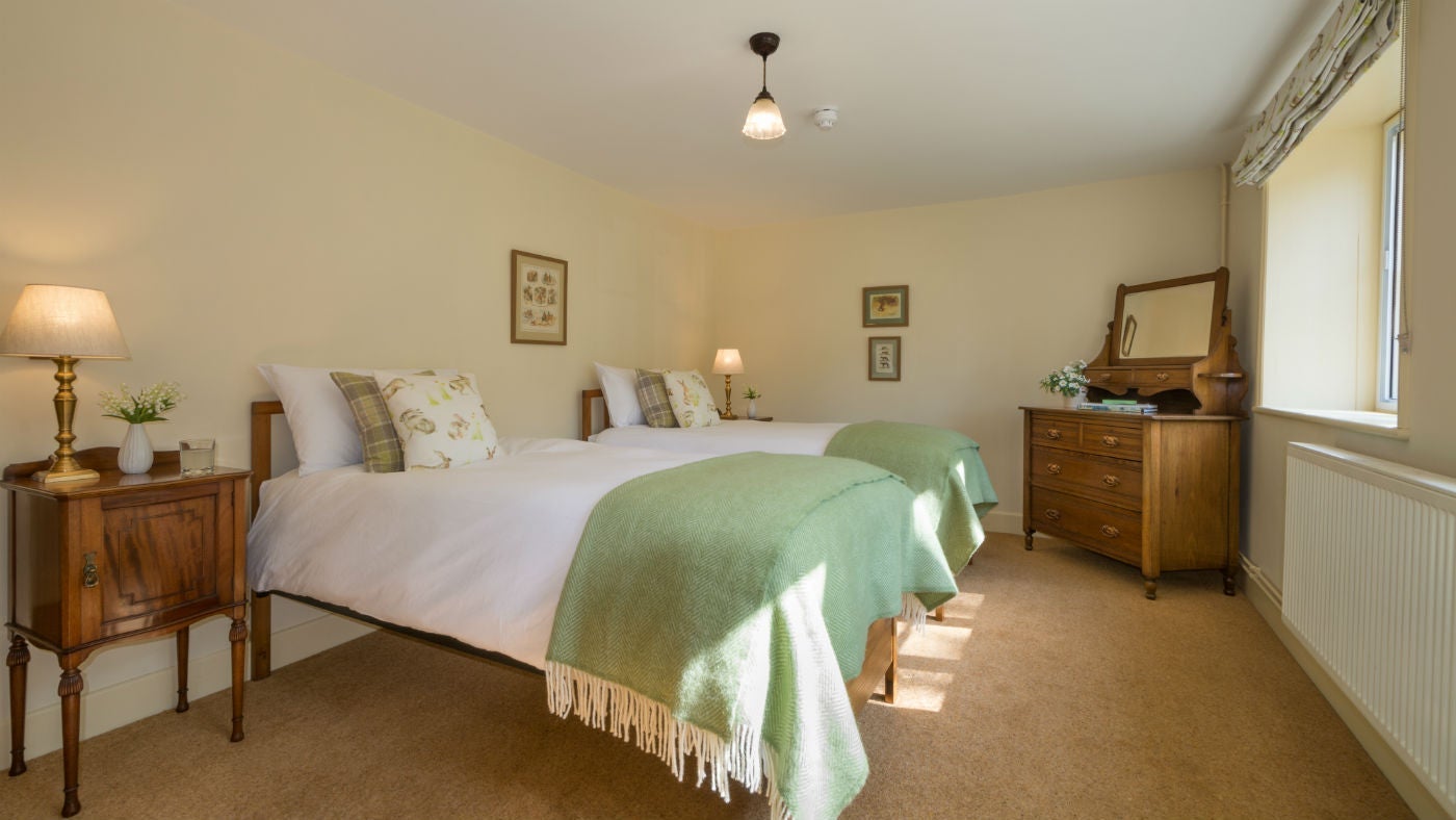 A twin bedroom at Mottistone Manor Farmhouse, Mottistone, Isle of Wight