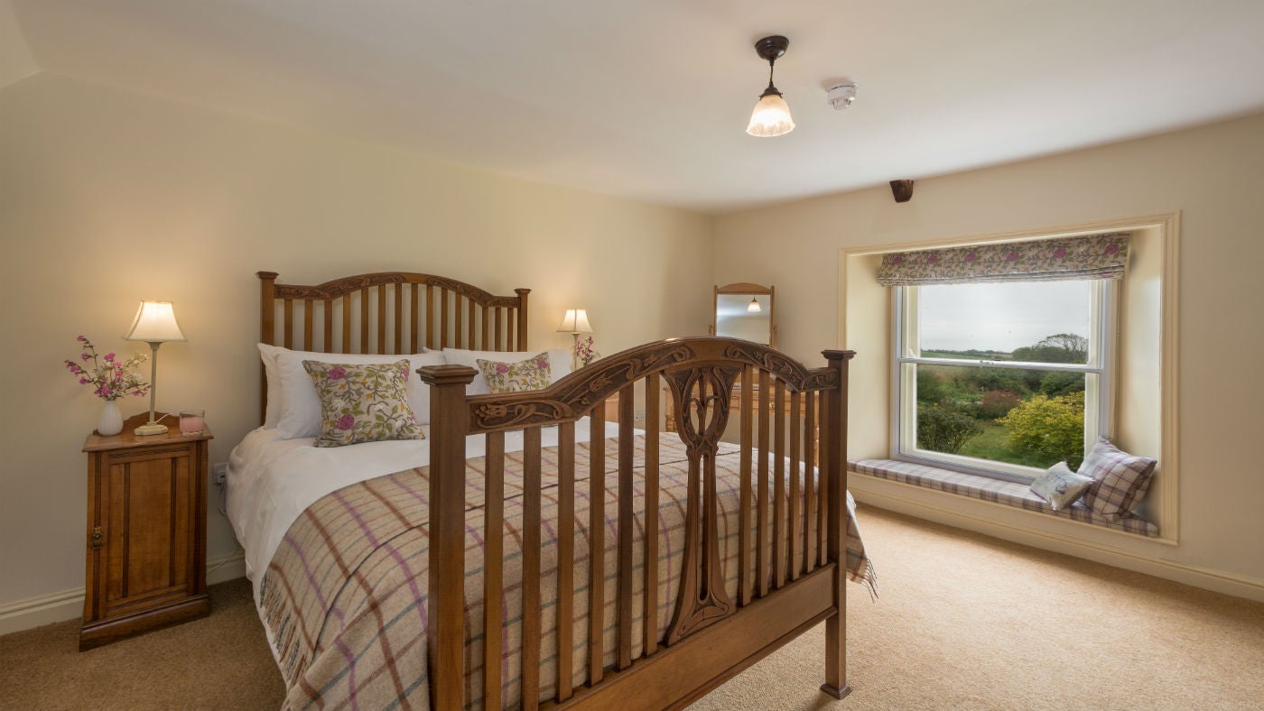 A double bedroom at Mottistone Manor Farmhouse, Mottistone, Isle of Wight
