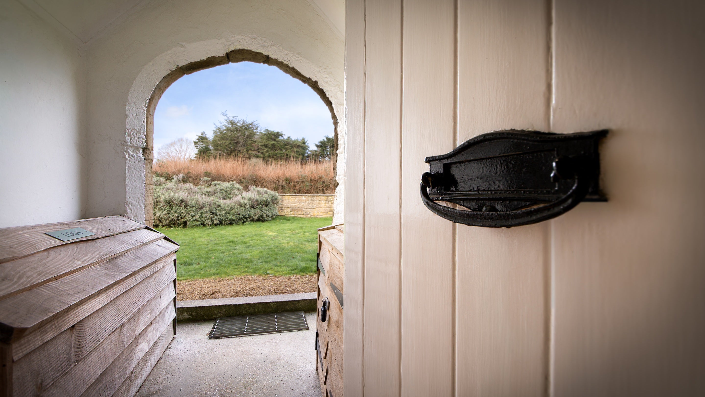 The front porch and log store at Old Church Lodge, Isle Of Wight