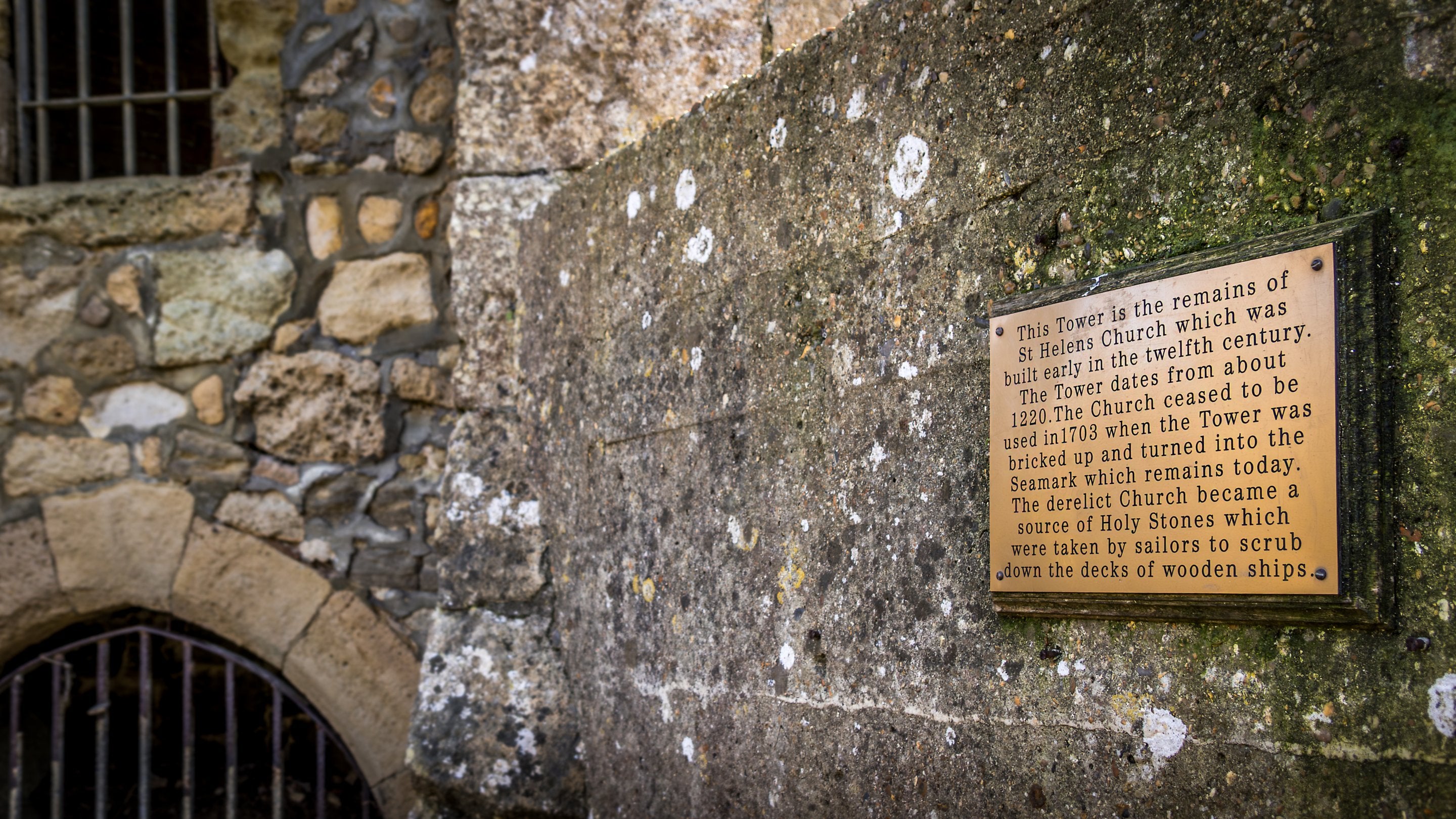 The visitor information plaque for the remaining tower of St. Helens Church, close to Old Church Lodge, Isle Of Wight