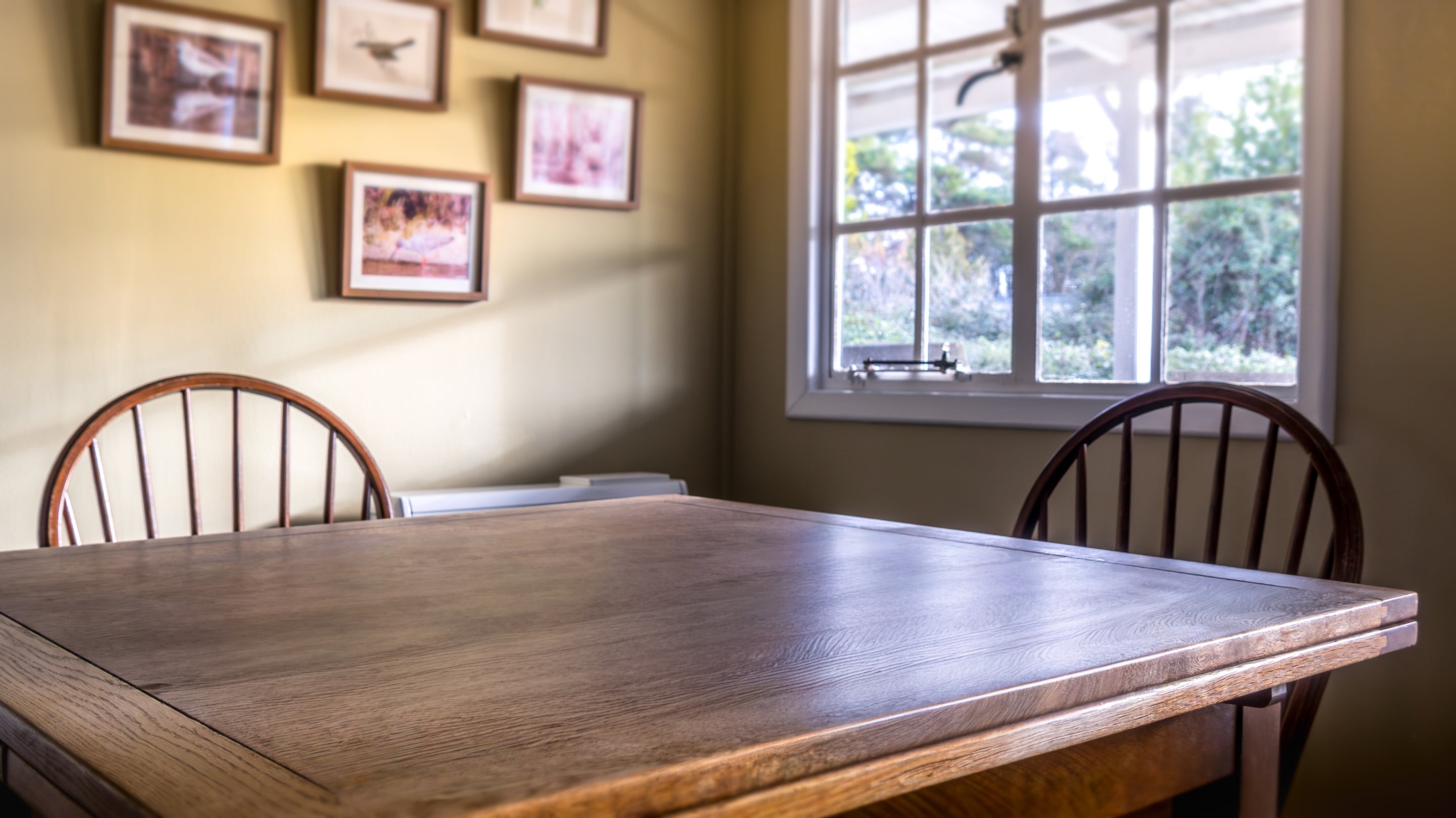 The dining table in the open-plan sitting and dining room at The Old Club House, Isle Of Wight