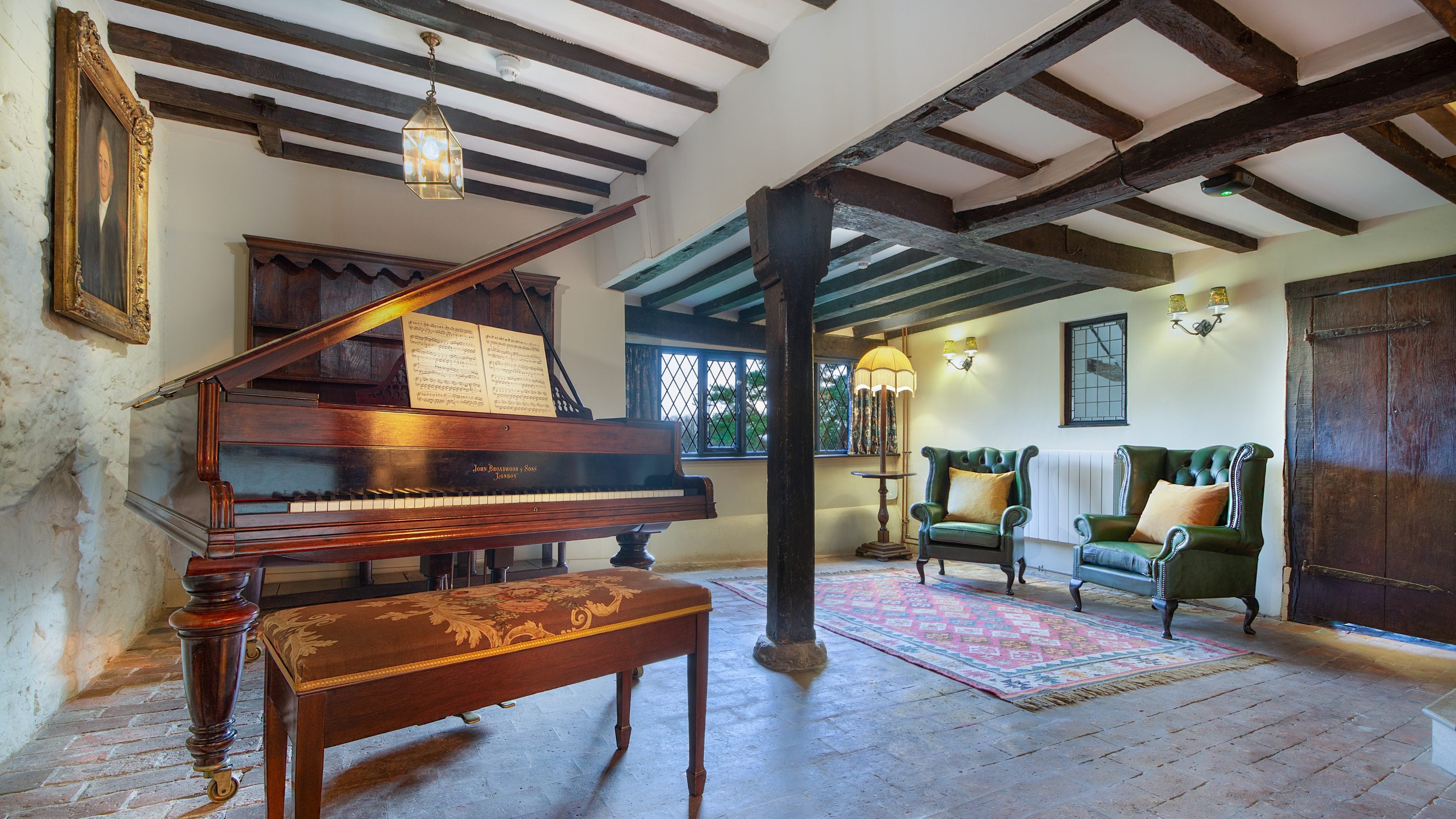 The piano room at Emley Farmhouse, Surrey