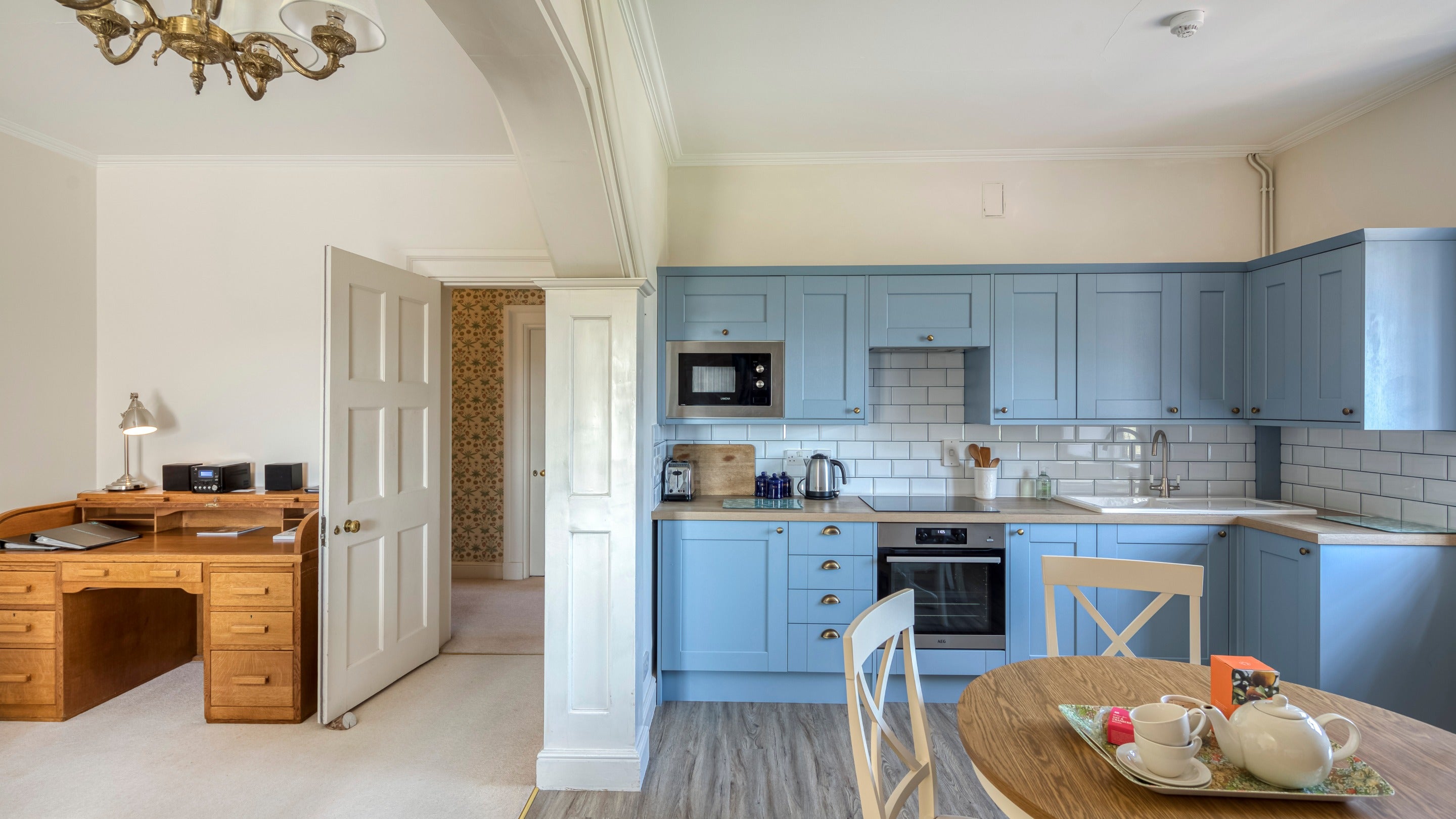 The open-plan kitchen, dining and sitting room at The Morris Apartment, West Sussex