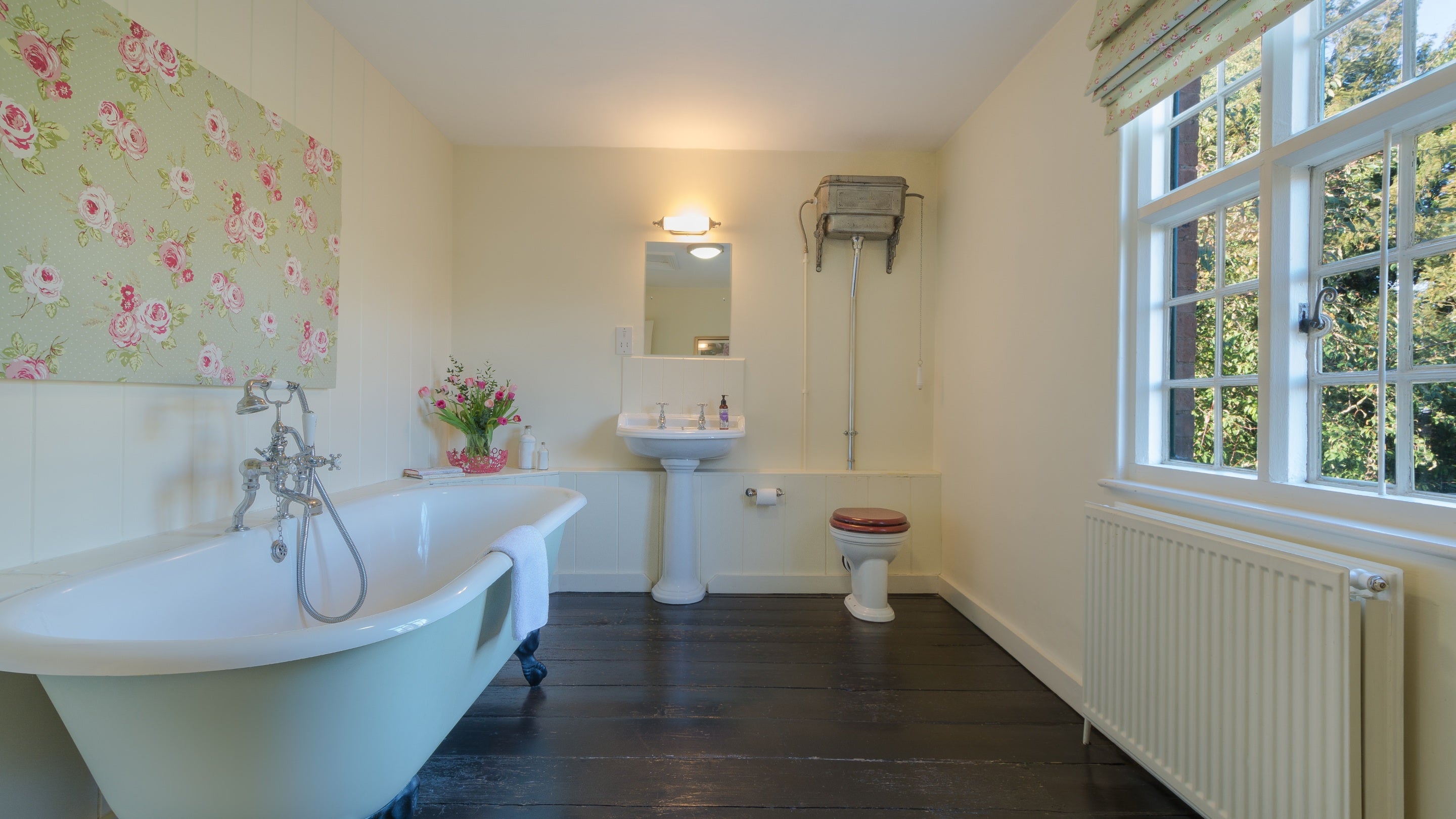 The family bathroom with roll-top bath at Polesden Garden Cottage, Surrey