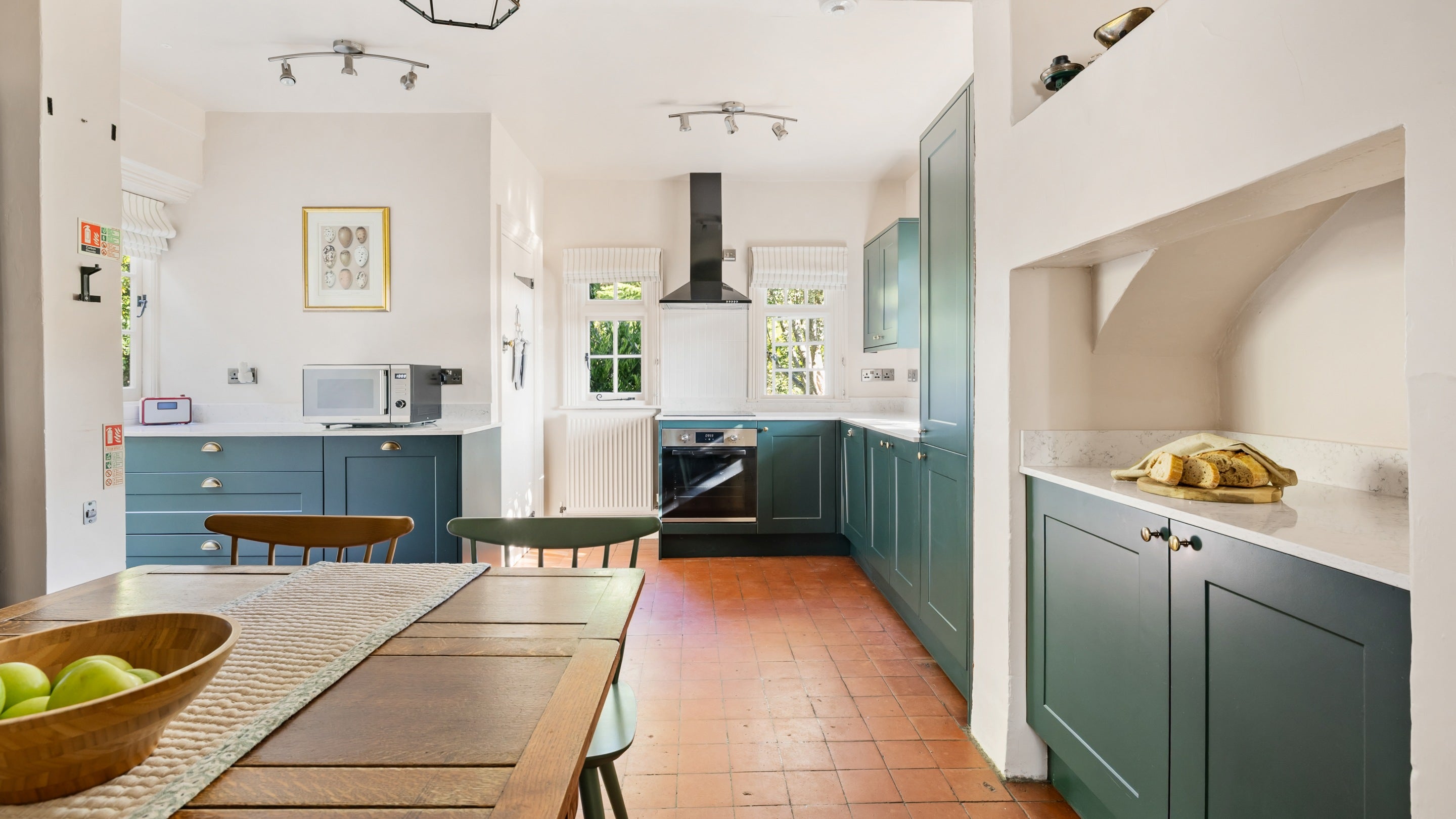 The kitchen with dining table at Polesden Garden Cottage, Surrey