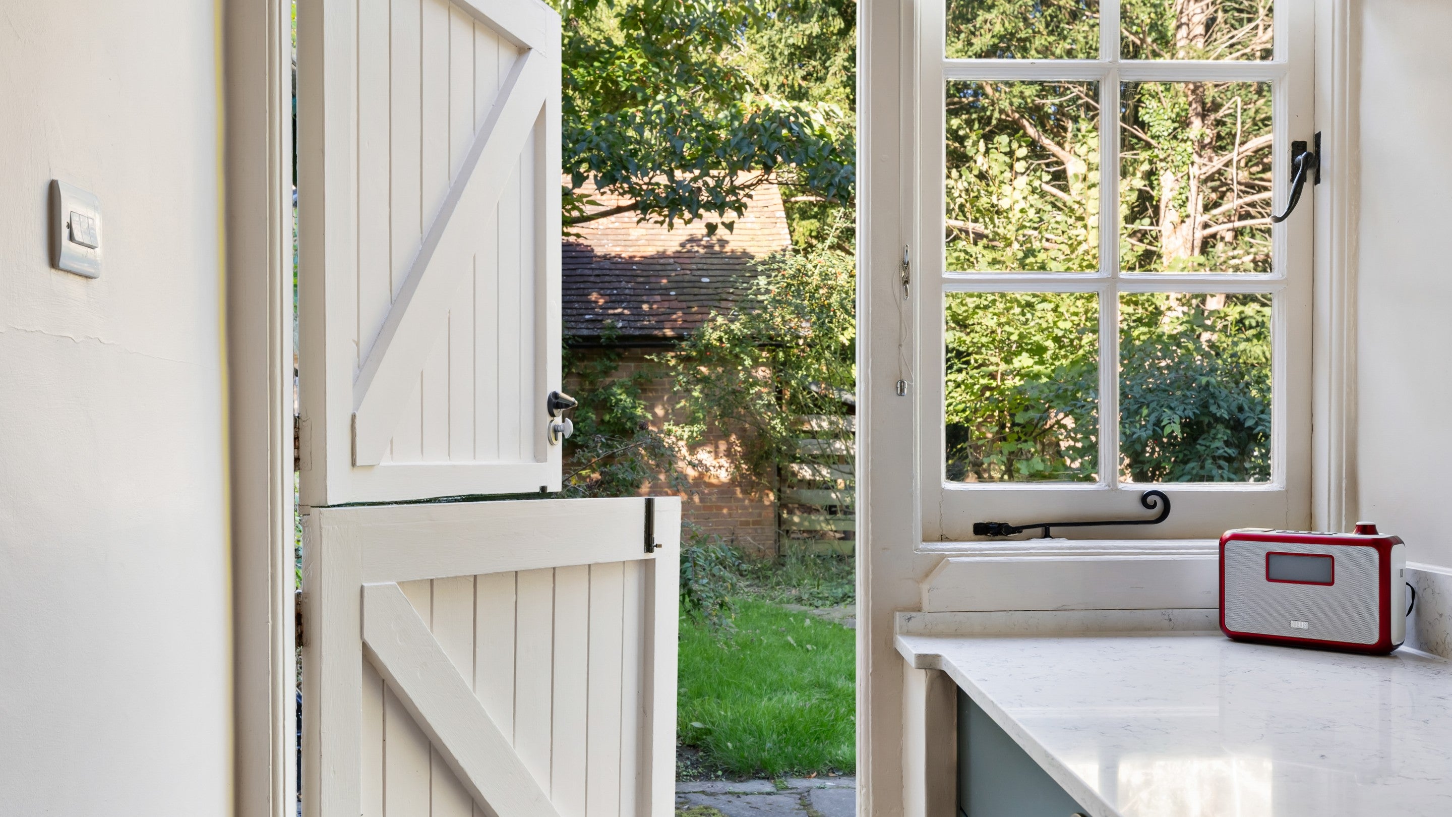 The door from the kitchen to the private garden at Polesden Garden Cottage, Surrey