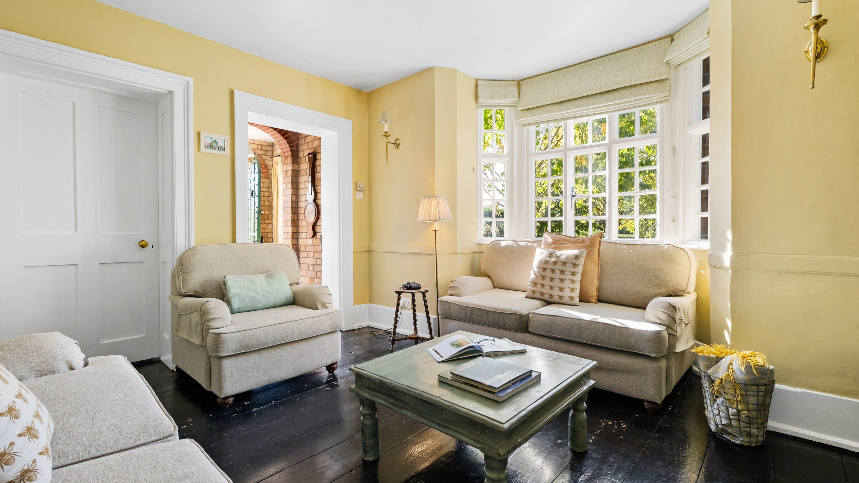 The sitting room at Polesden Garden Cottage, with door out to the Polesden Lacey gardens, Surrey
