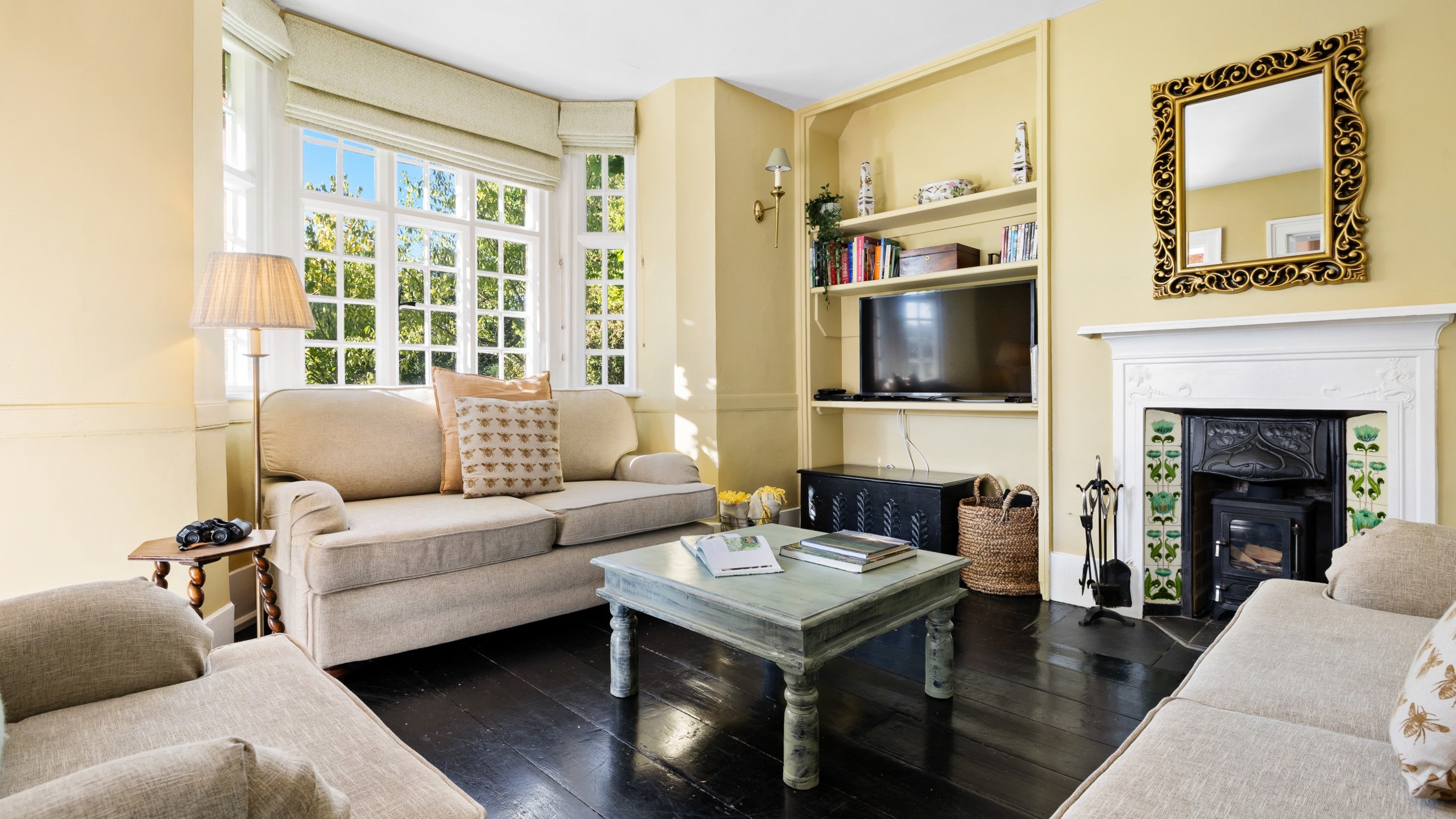 The sitting room with woodburner at Polesden Garden Cottage, Surrey