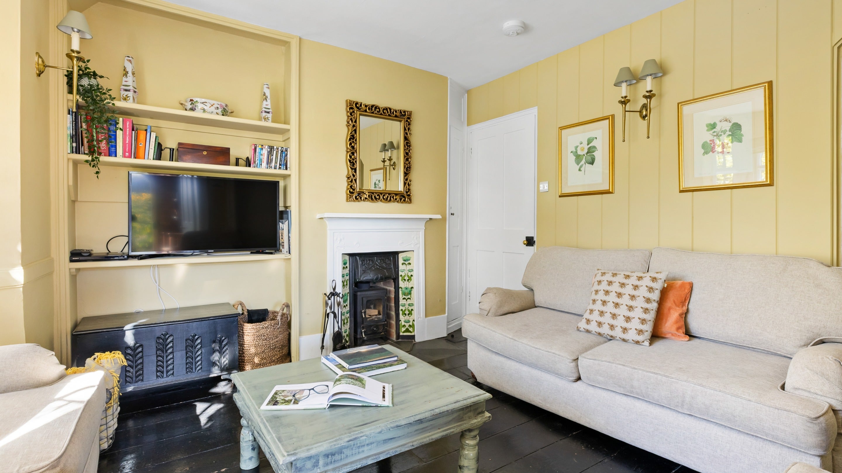 The sitting room with woodburner at Polesden Garden Cottage, Surrey