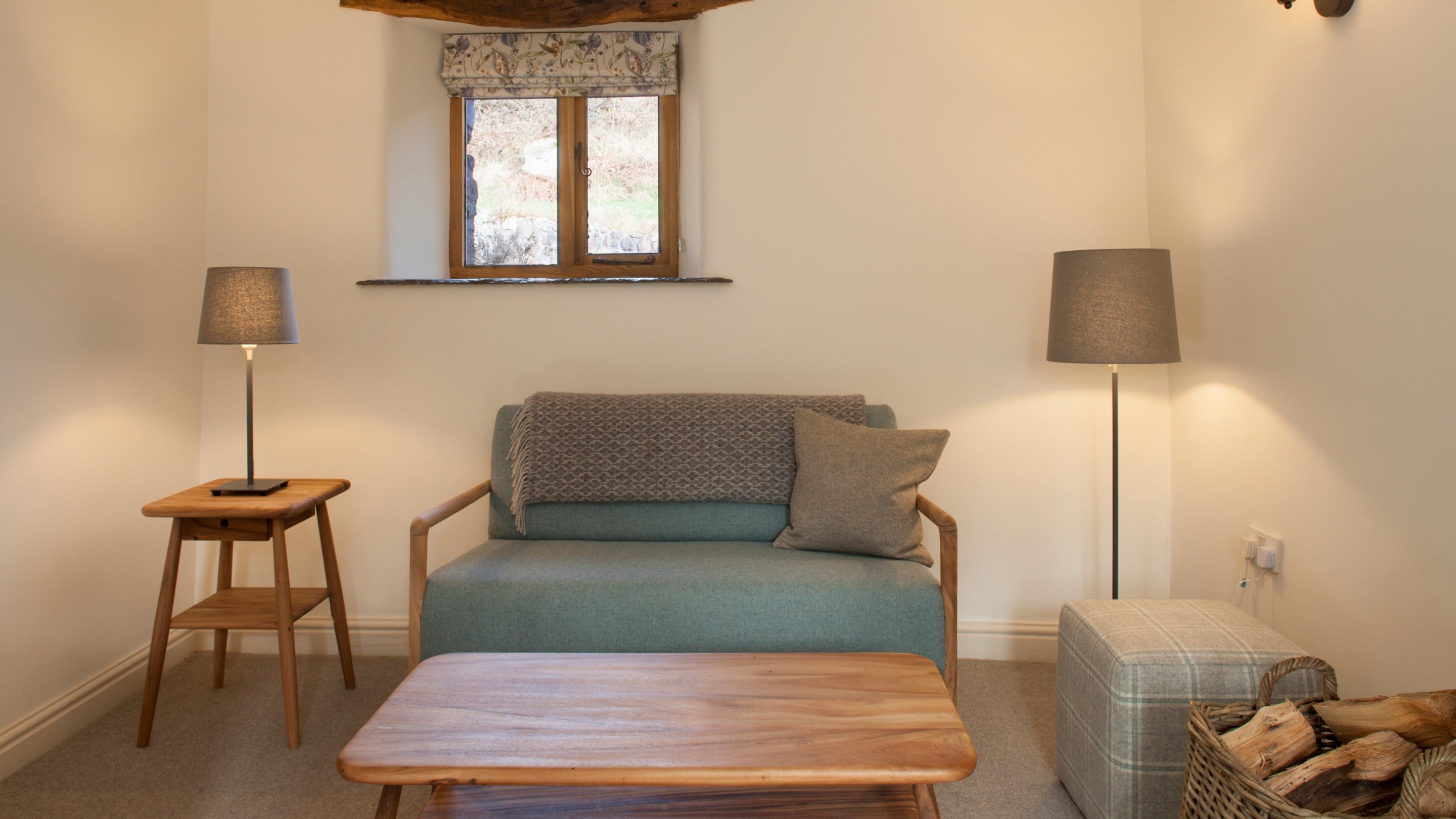 A sofa in the sitting room at Eelbeck Cottage, Cumbria