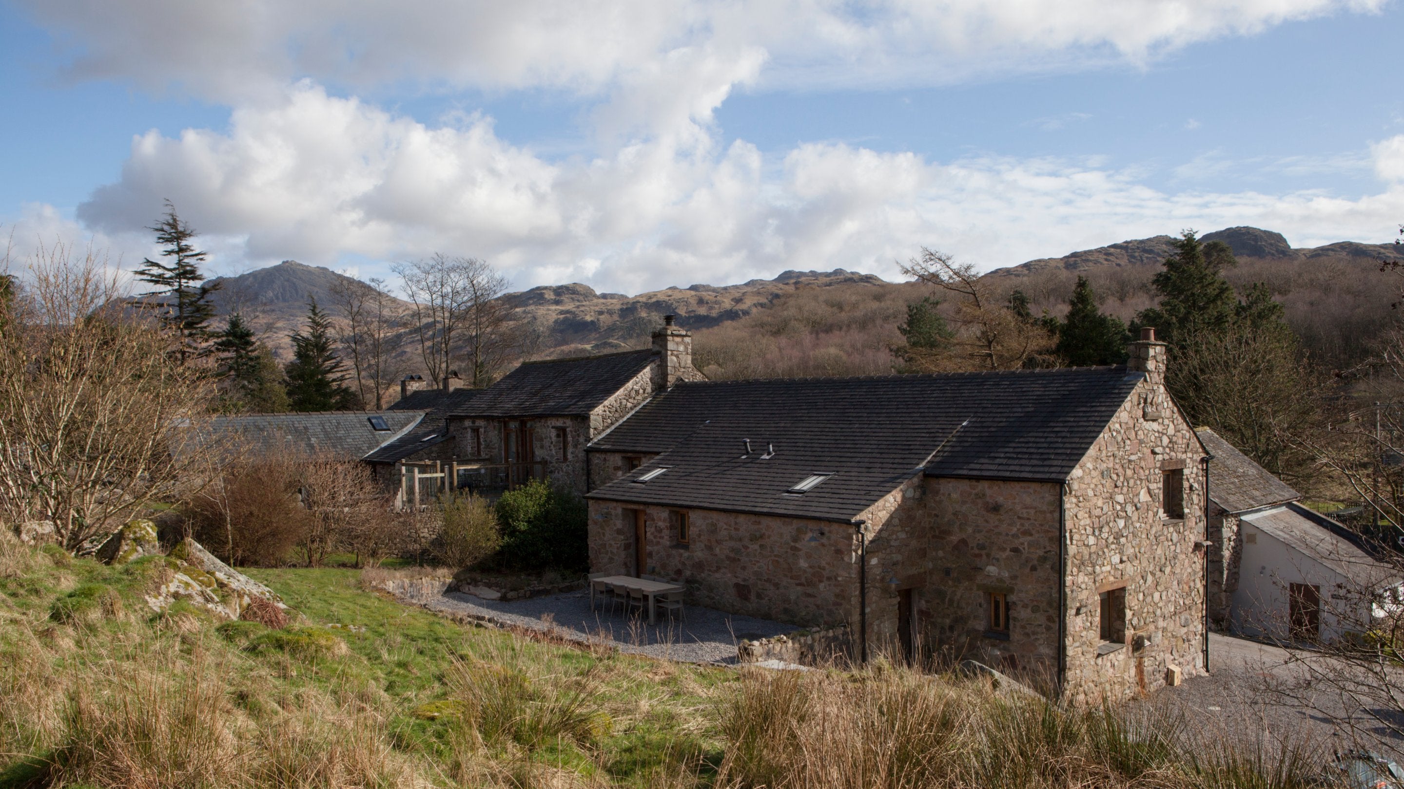 The back of Eelbeck Cottage and its patio, Cumbria