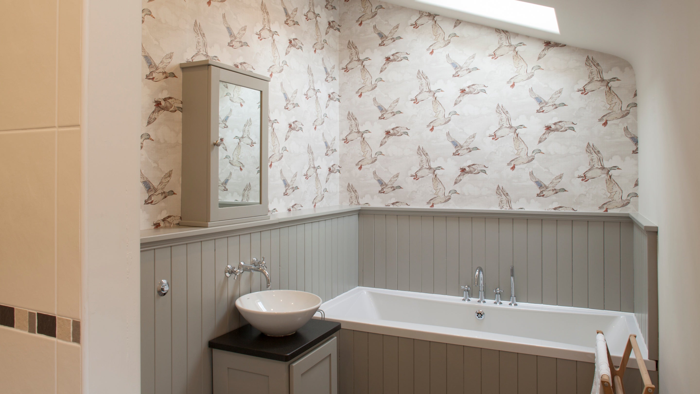 The bathroom with bath and separate shower at Eelbeck Cottage, Cumbria