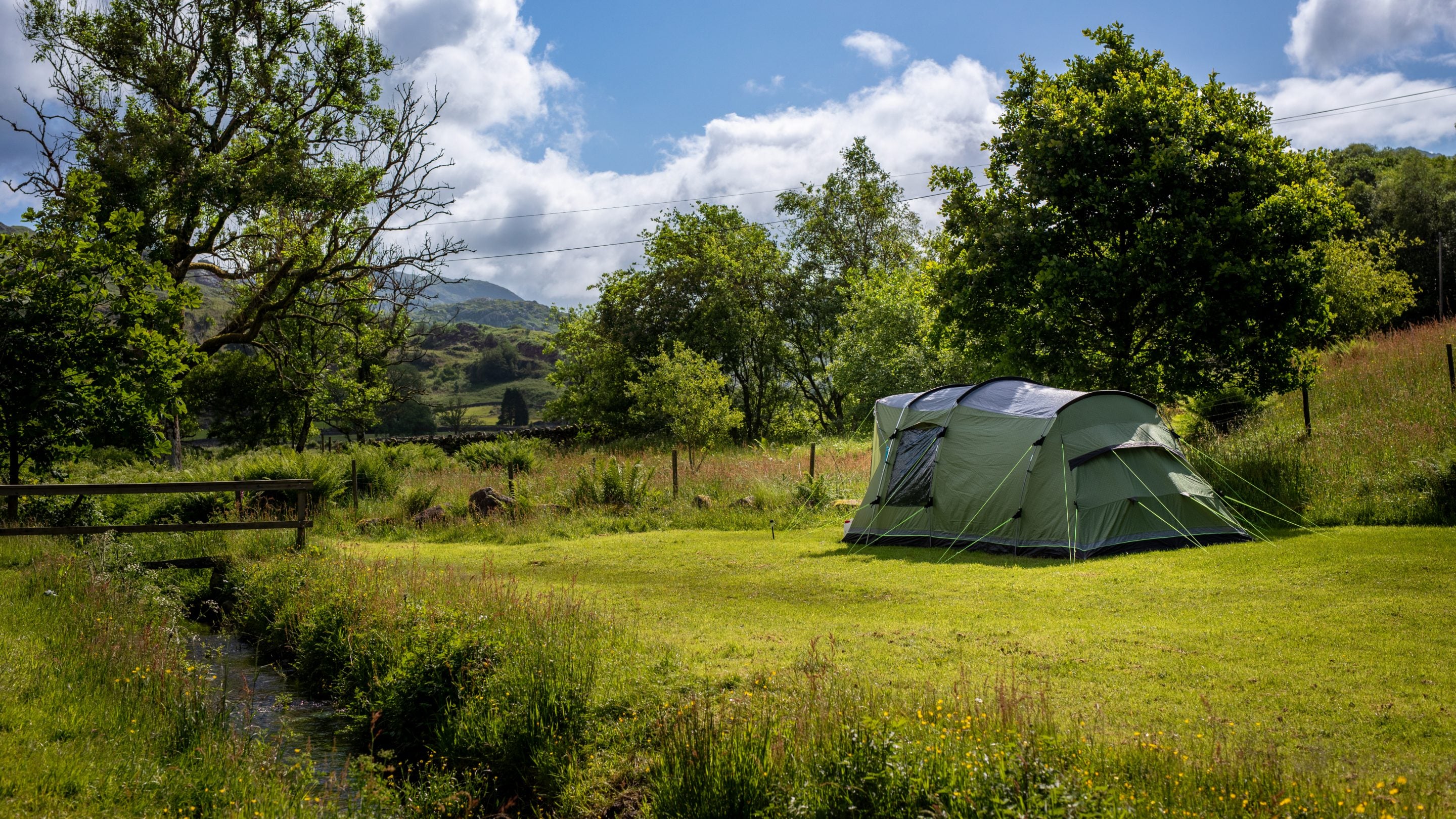 A tent in the car-free meadow at Eskdale Campsite, Cumbria
