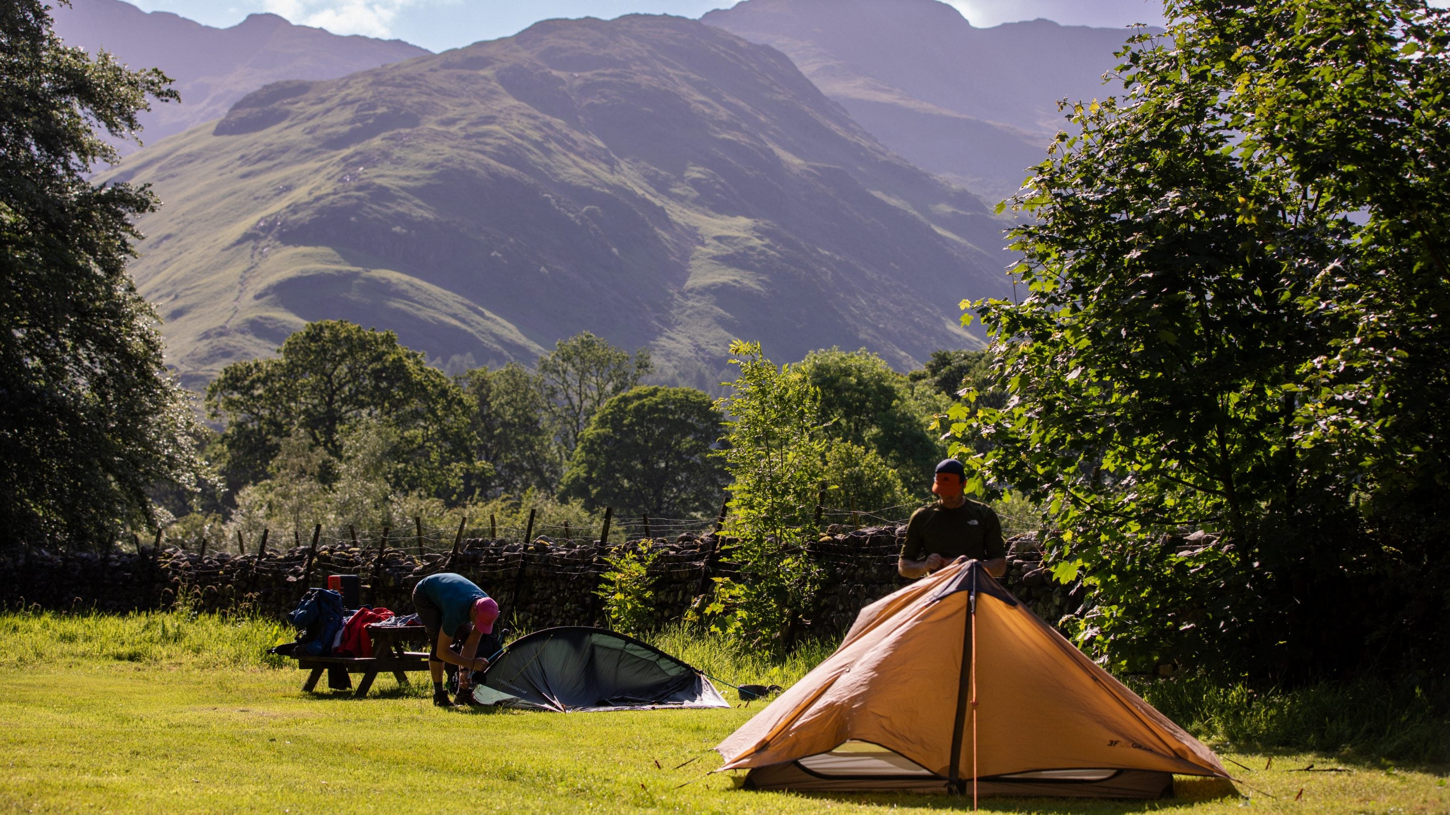 People putting up their tents at Great Langdale Campsite, Cumbria