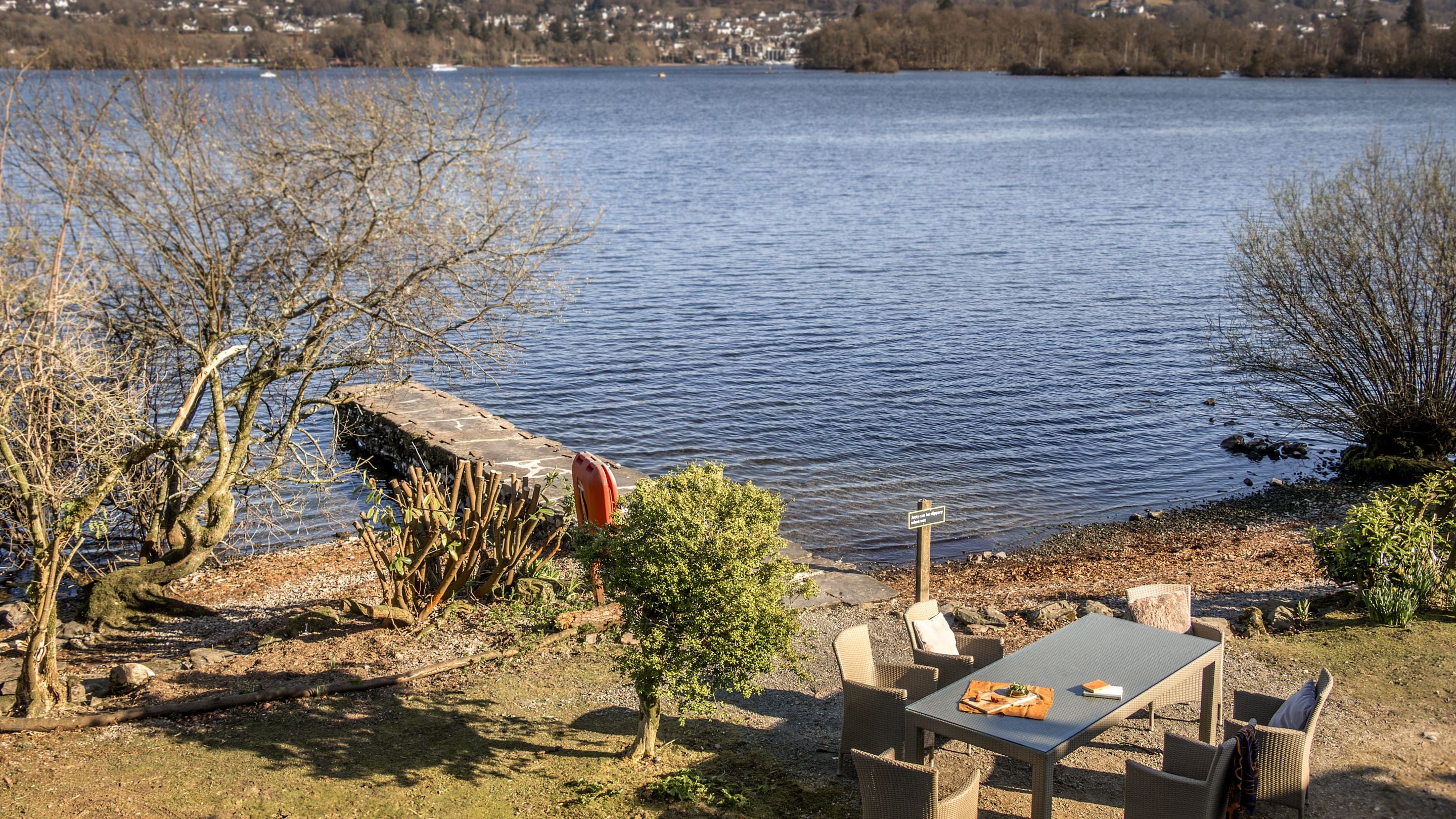 The garden and lake, viewed from the balcony, at High Strawberry Gardens, Cumbria