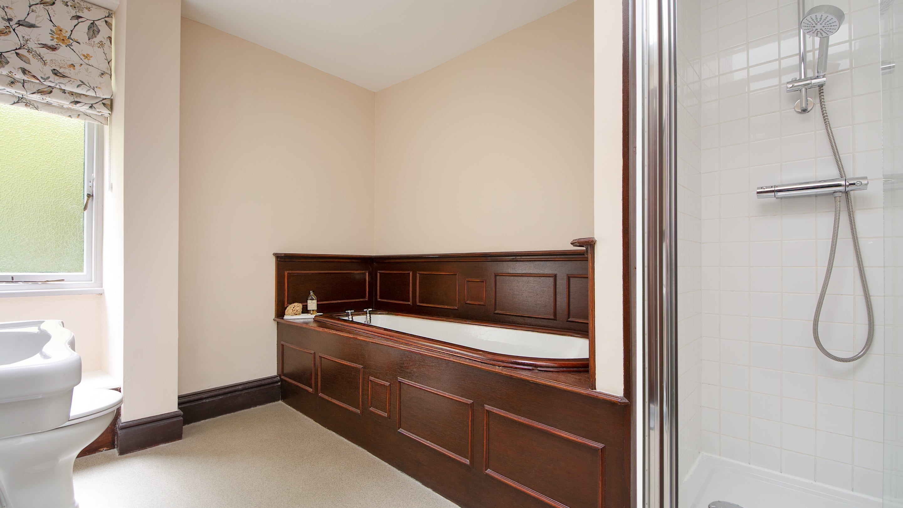 The bathroom with freestanding bath and walk-in shower on the second floor at Millbeck Towers, Cumbria