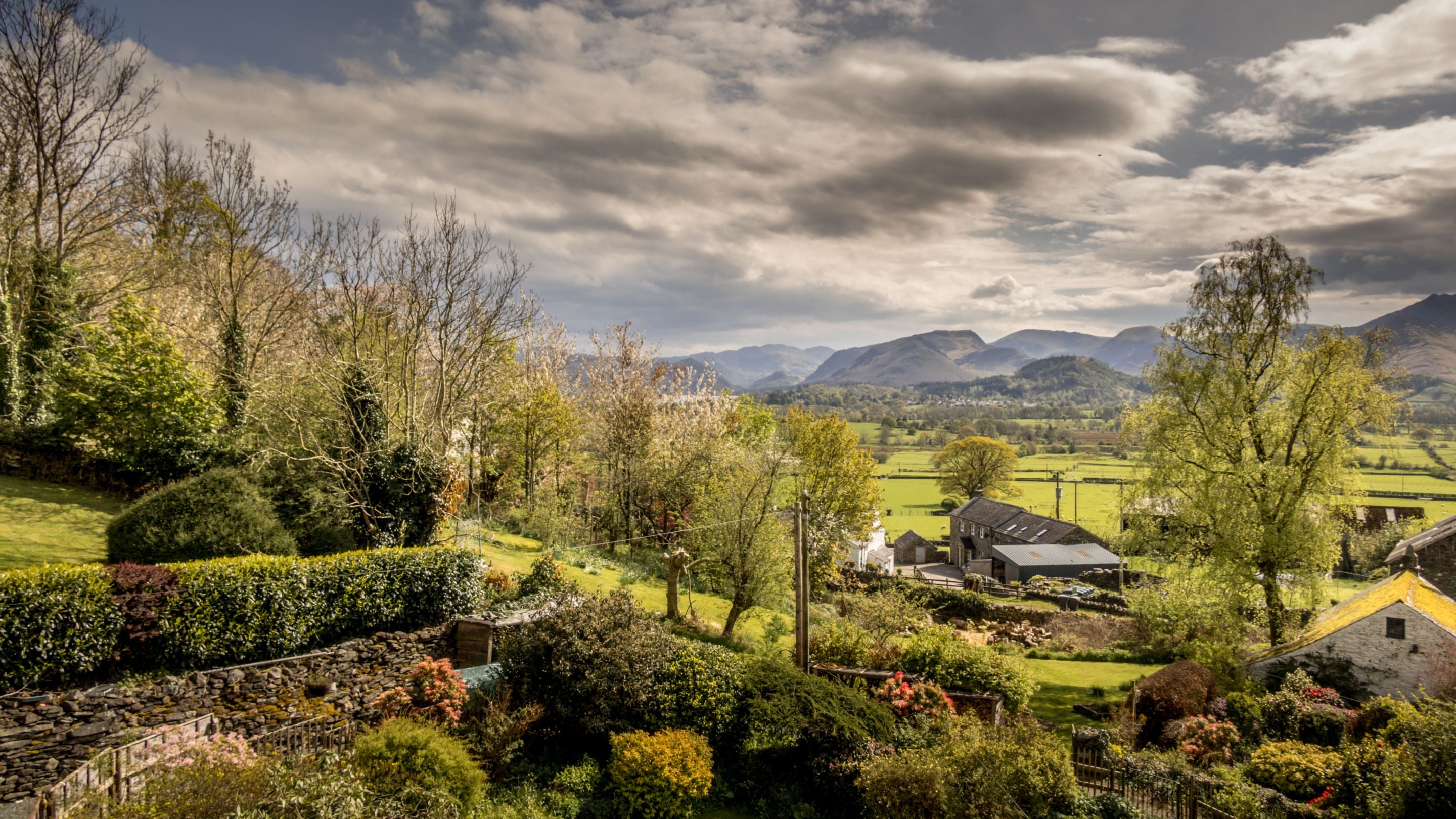 An aerial view of the front garden, looking towards the fells around Derwentwater, including Catbells, Cumbria