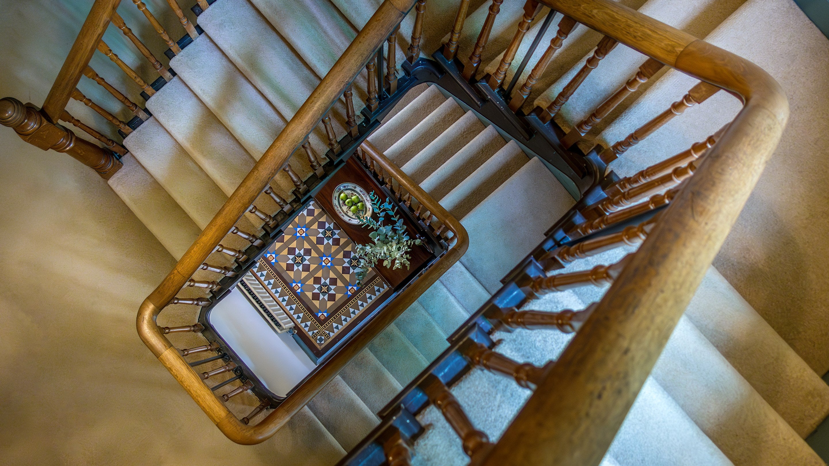 Looking down at the original staircase from the second floor at Millbeck Towers, Cumbria