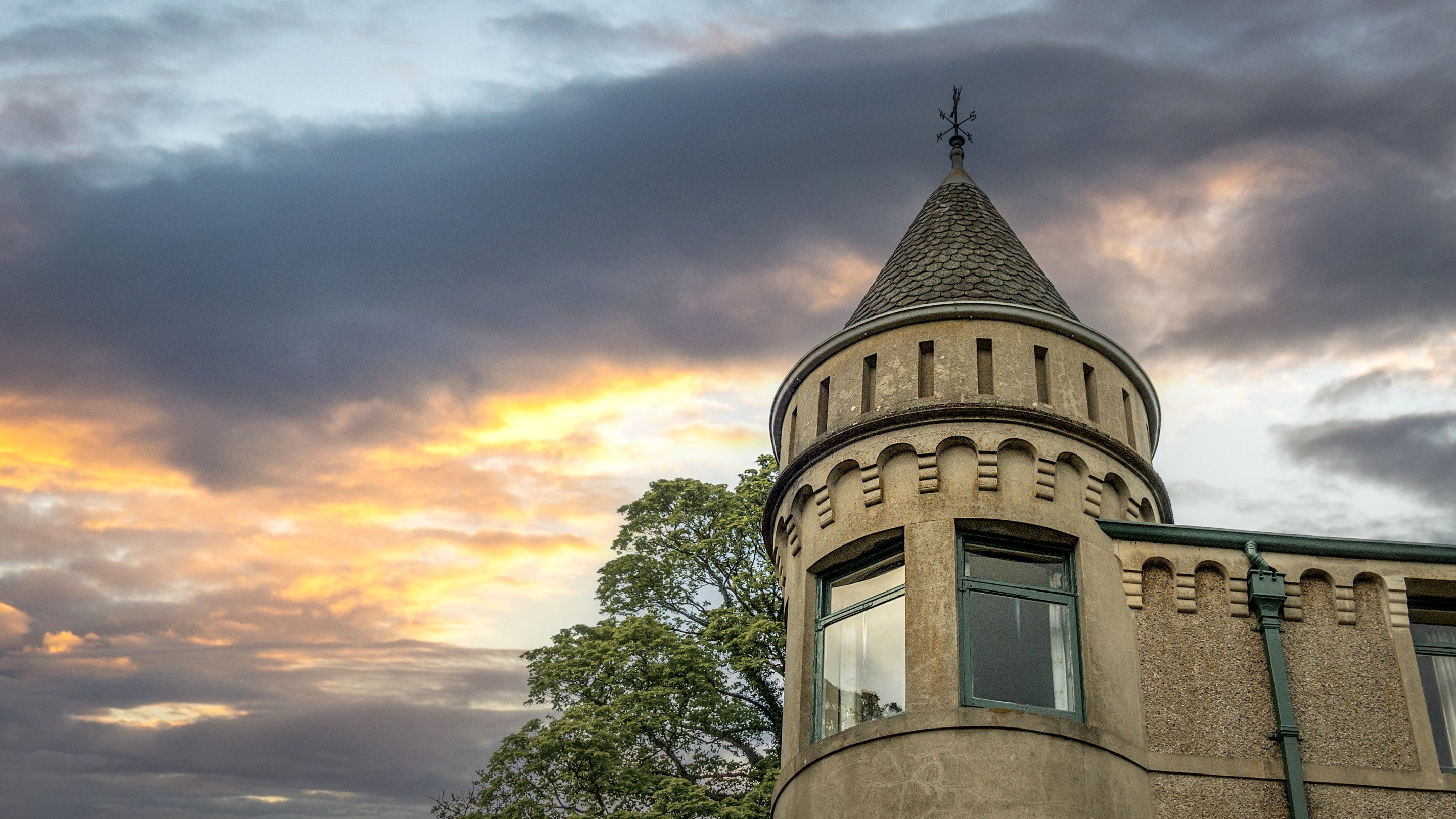 The top of the left turret at Millbeck Towers, with windows of a second floor double bedroom, Cumbria