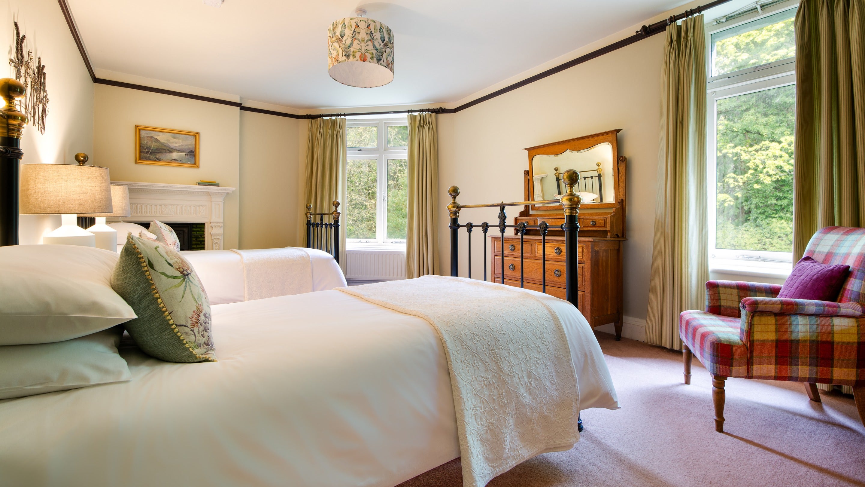 The second floor twin bedroom, which overlooks the large rear garden at Millbeck Towers, Cumbria