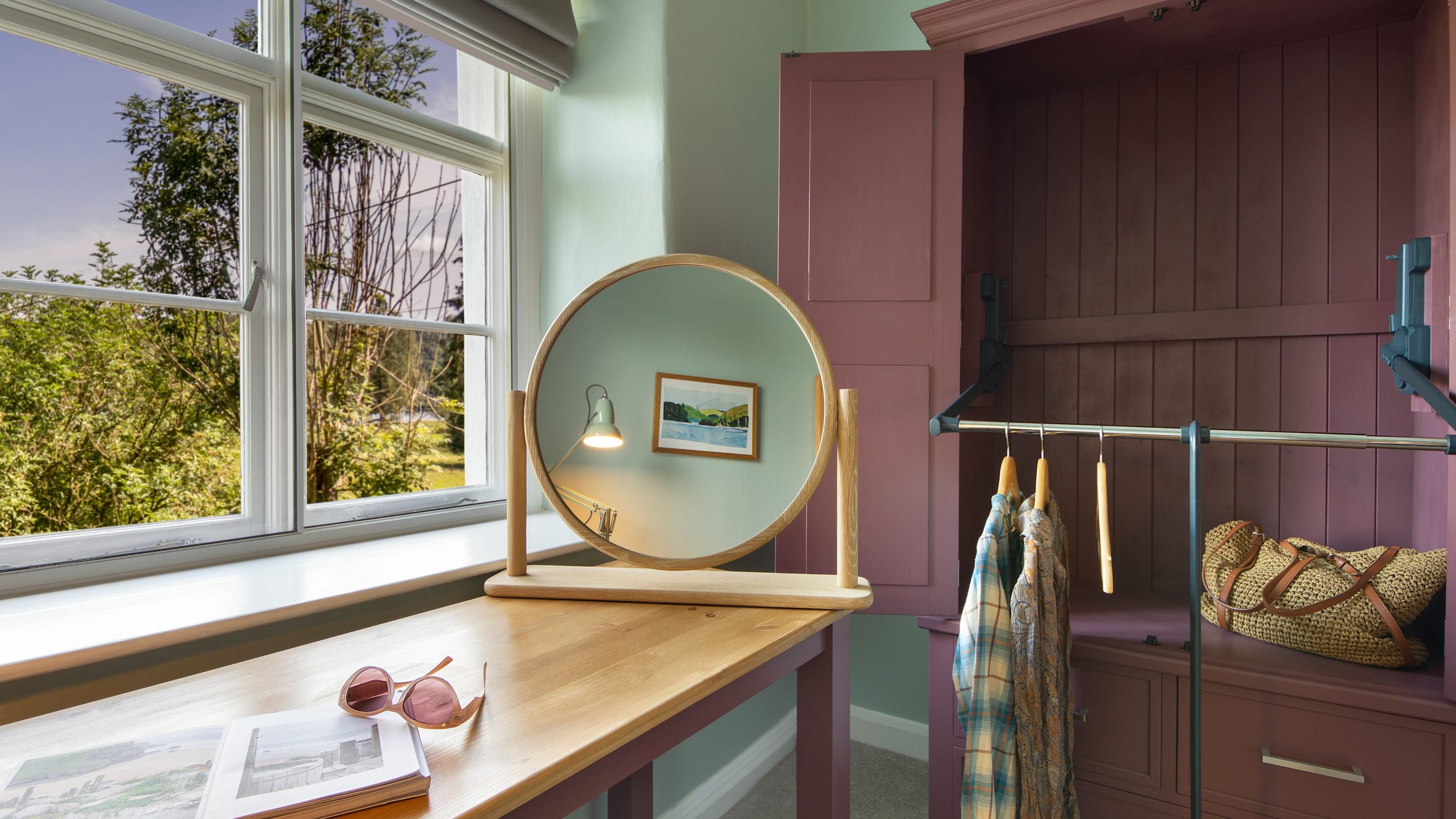 Adjustable clothes storage in the bedroom at Restharrow, Cumbria
