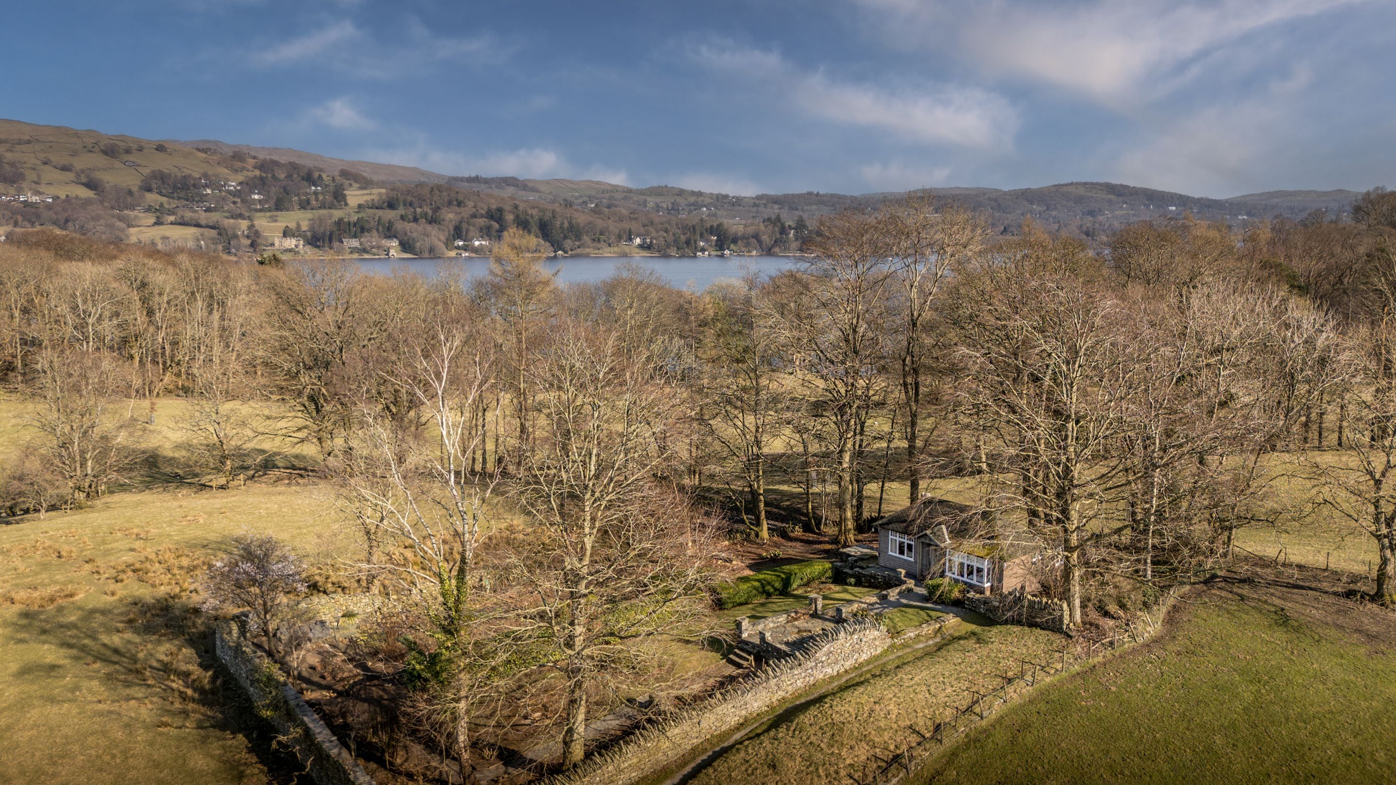 An aerial view of The Summer House, with Lake Windermere in the background, Cumbria