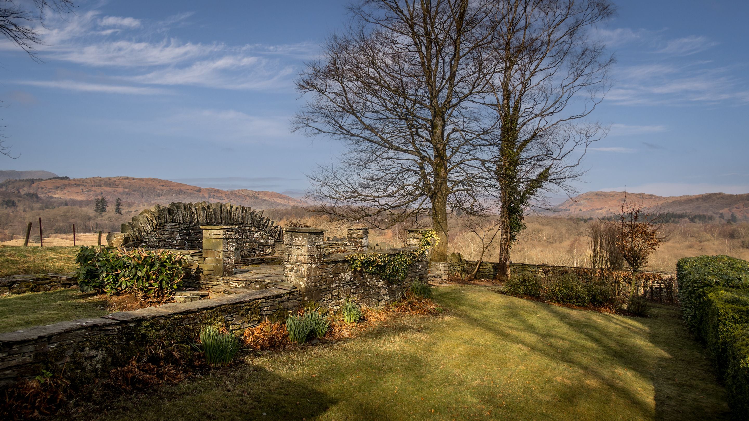 The garden lawn at the front of The Summer House, with views of Lake District hills beyond, Cumbria