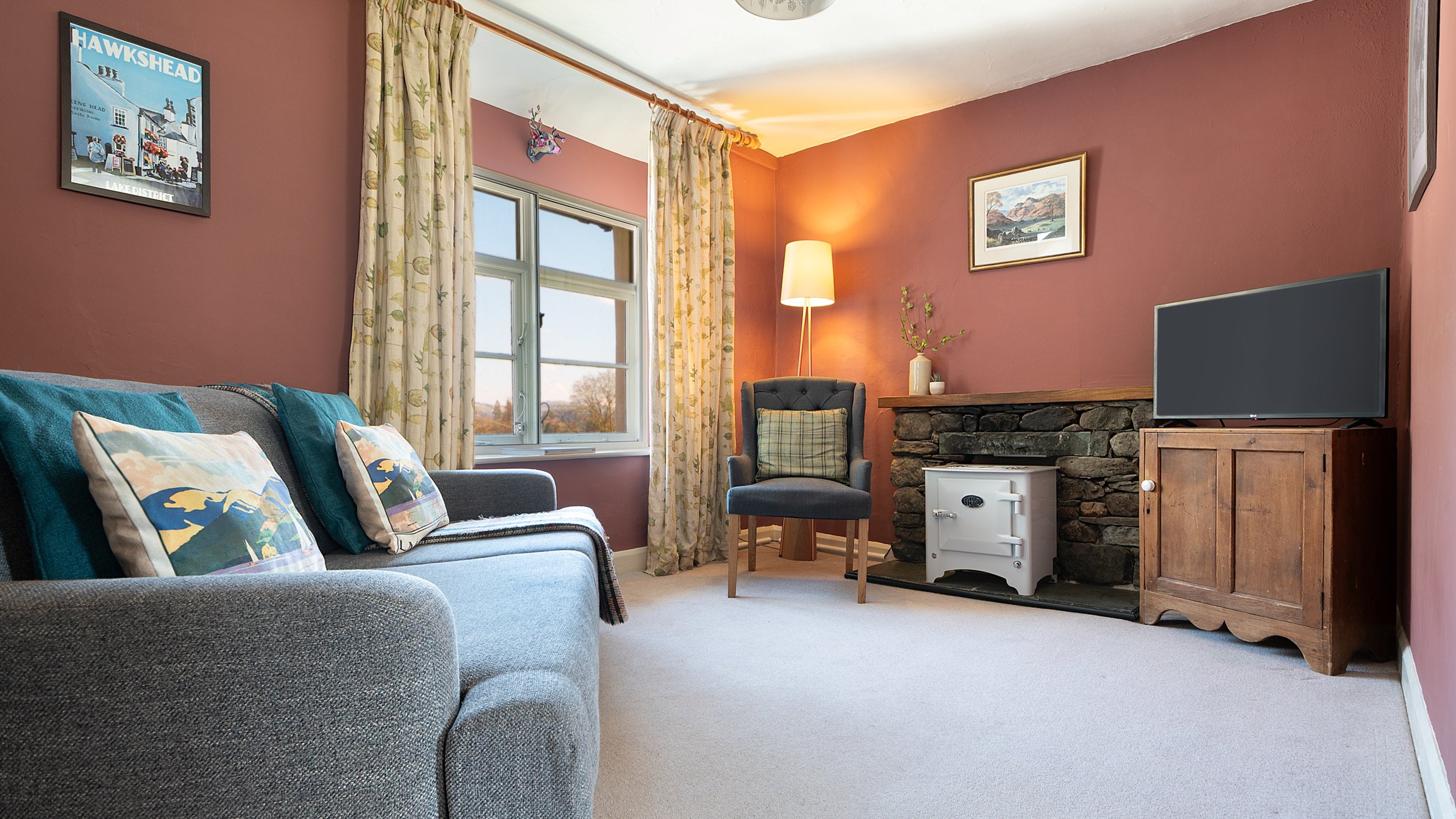 The sitting room at Tanner Brow, with everhot electric stove in the fireplace, Cumbria
