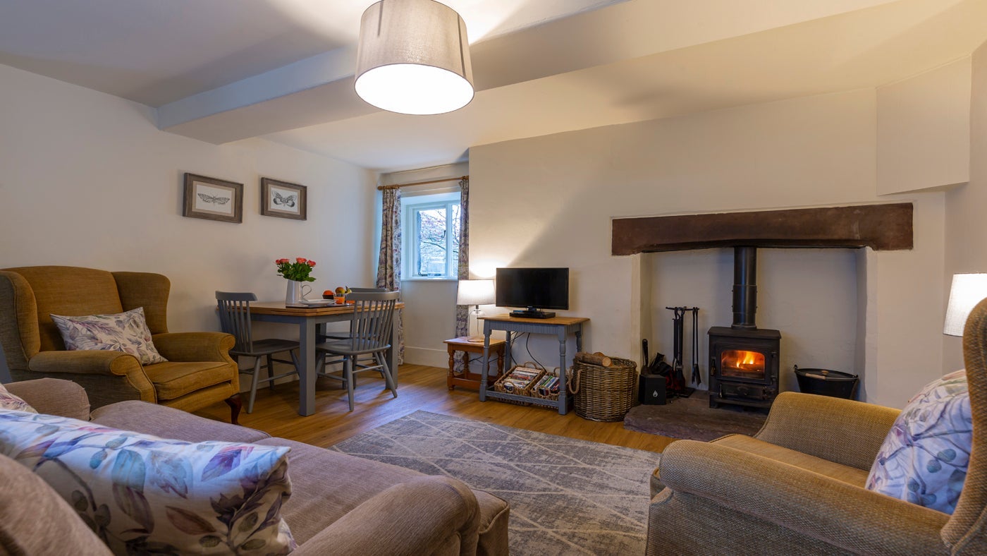 The sitting room and dining area at Wasdale Hall Lodge, Gosforth, Lake District, Cumbria
