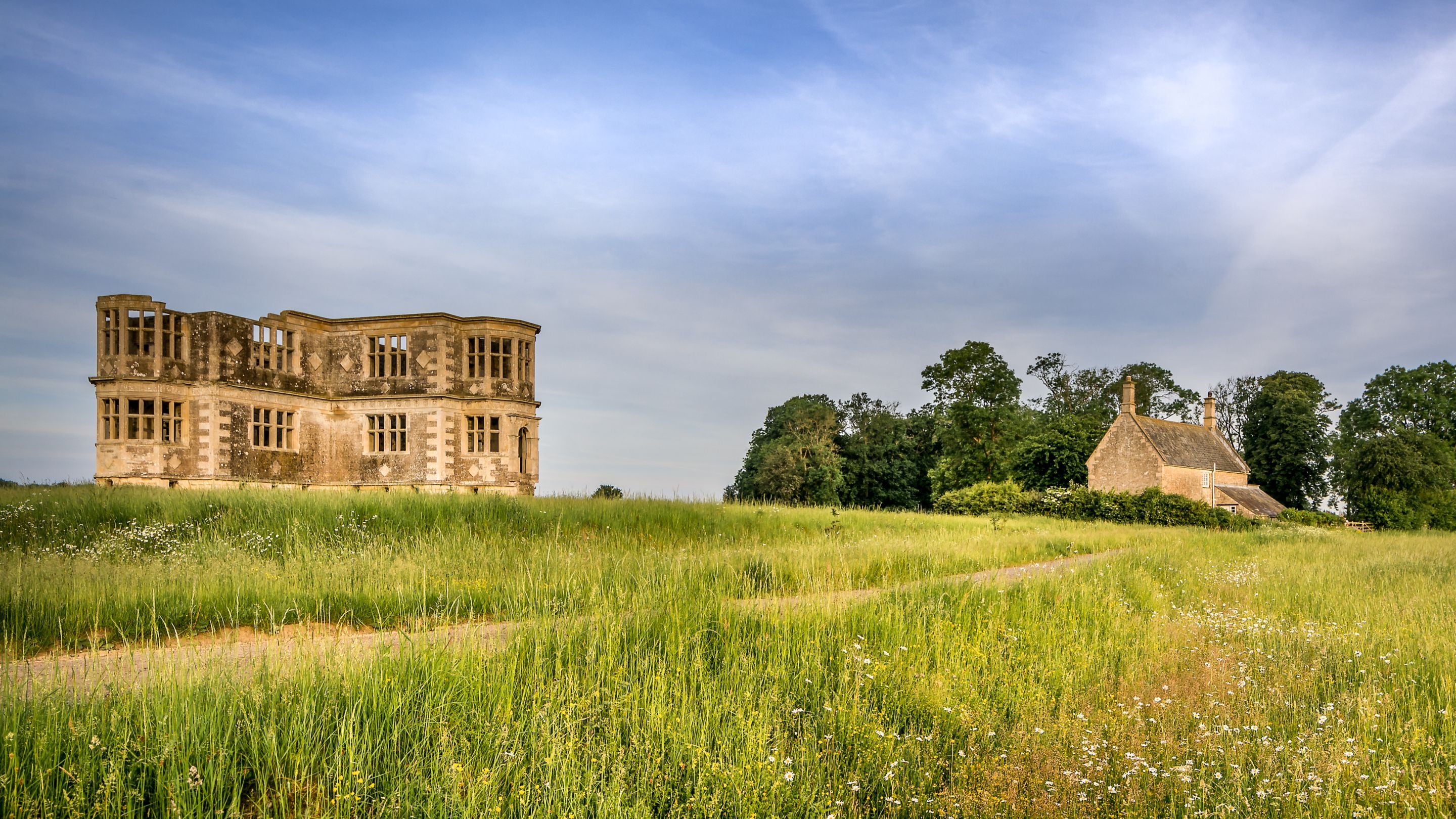 Lyveden Cottage, overlooked by the unfinished Lyveden Garden Lodge, Northamptonshire