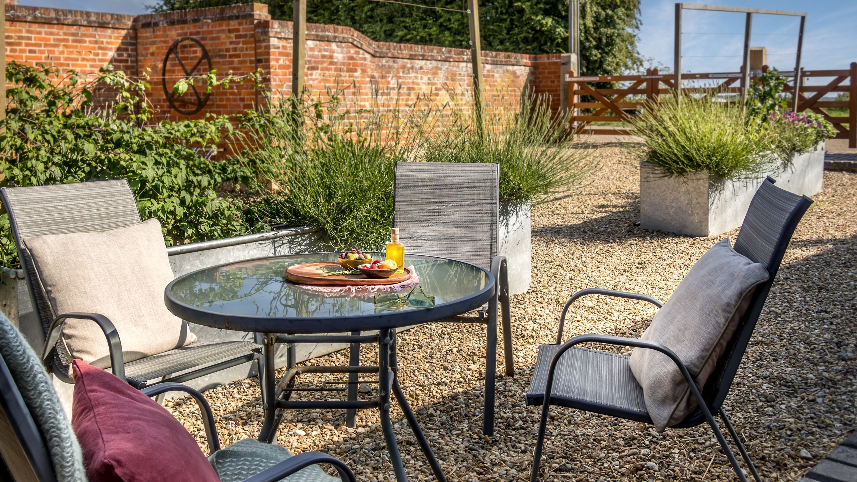The outdoor dining furniture in the courtyard at the front of 1 Horsey Barns, Norfolk