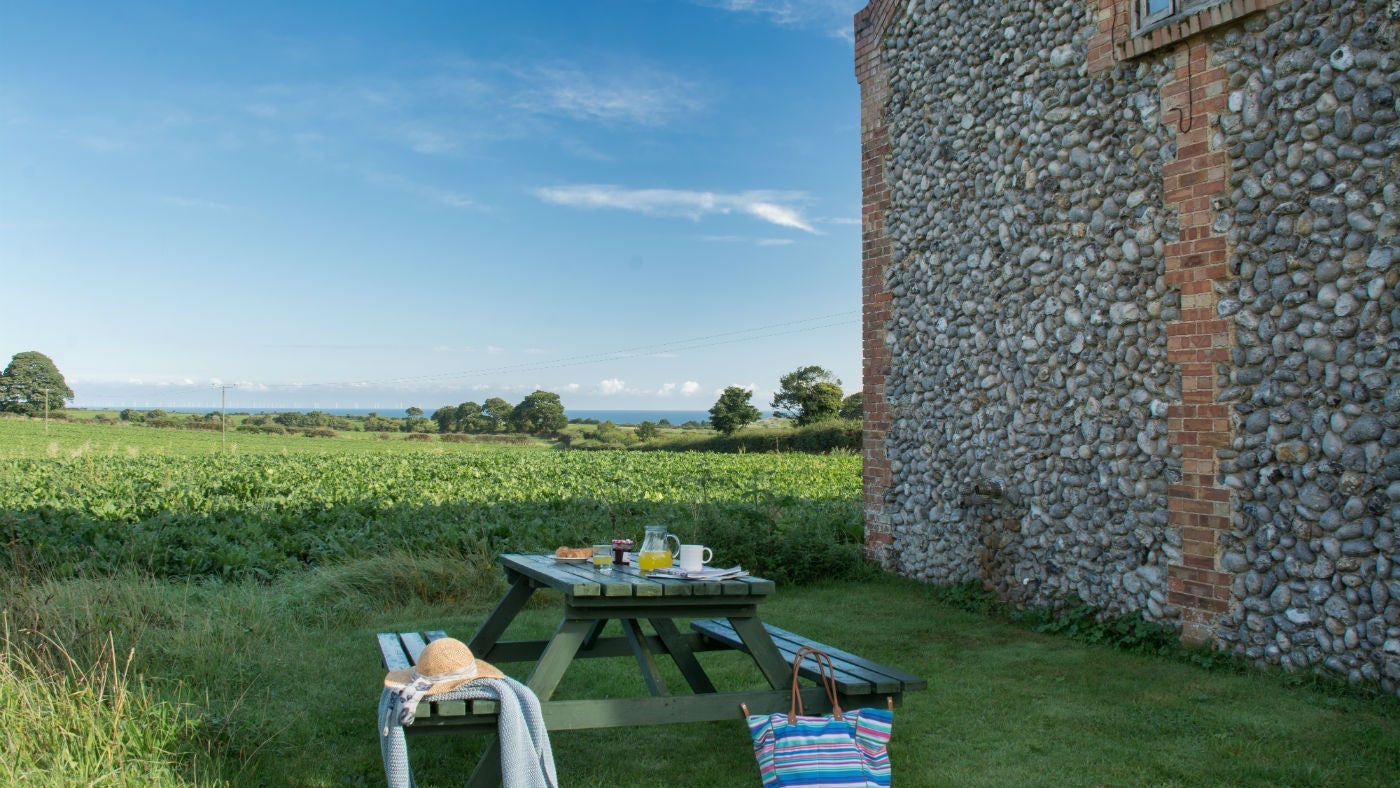 The pleasant outside seating area at 3 Cart Lodge Barn, Upper Sheringham, Norfolk
