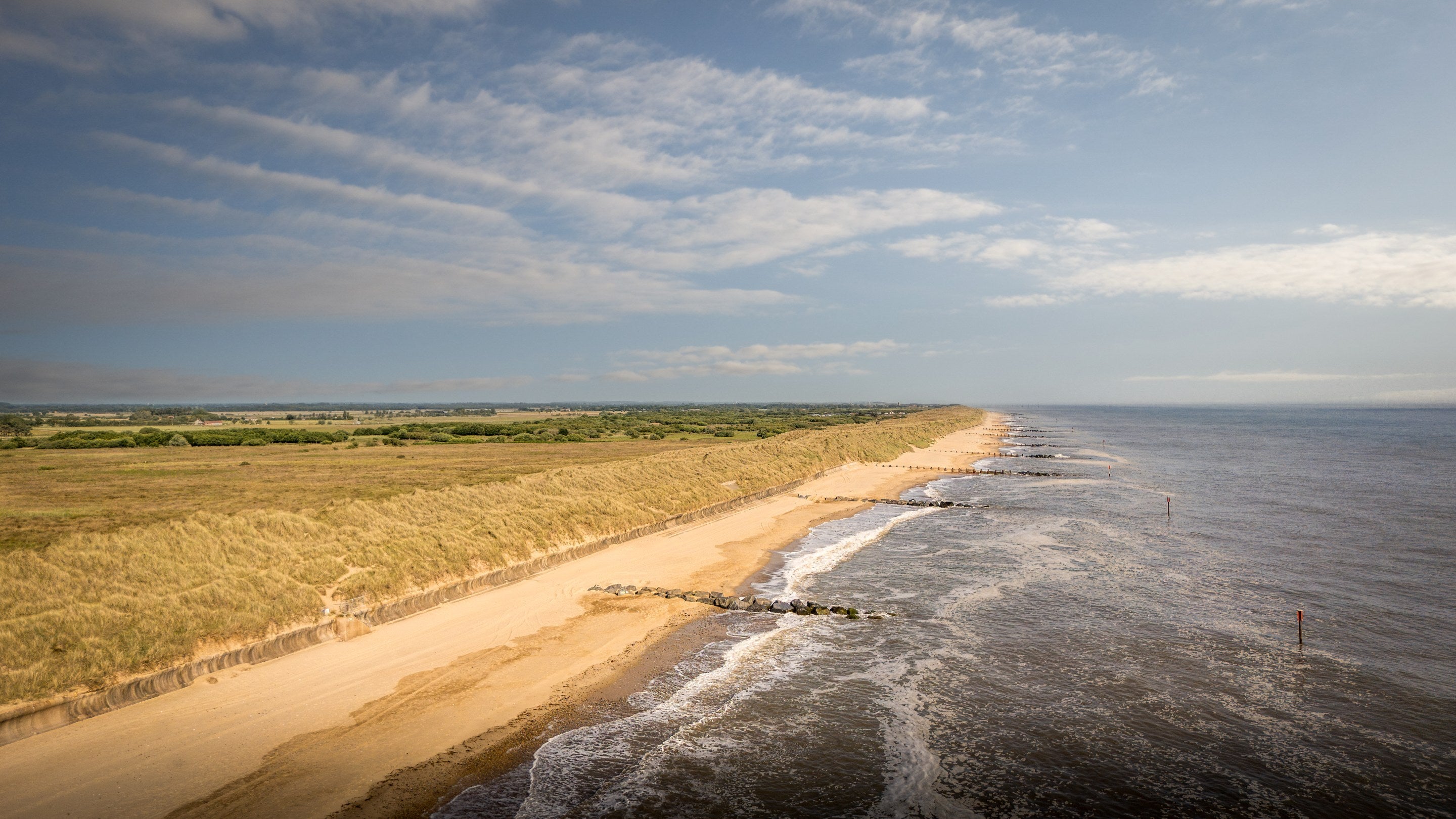 An aerial view of the miles of golden sand beach near 1, 2 and 3 Horsey Barns, Norfolk