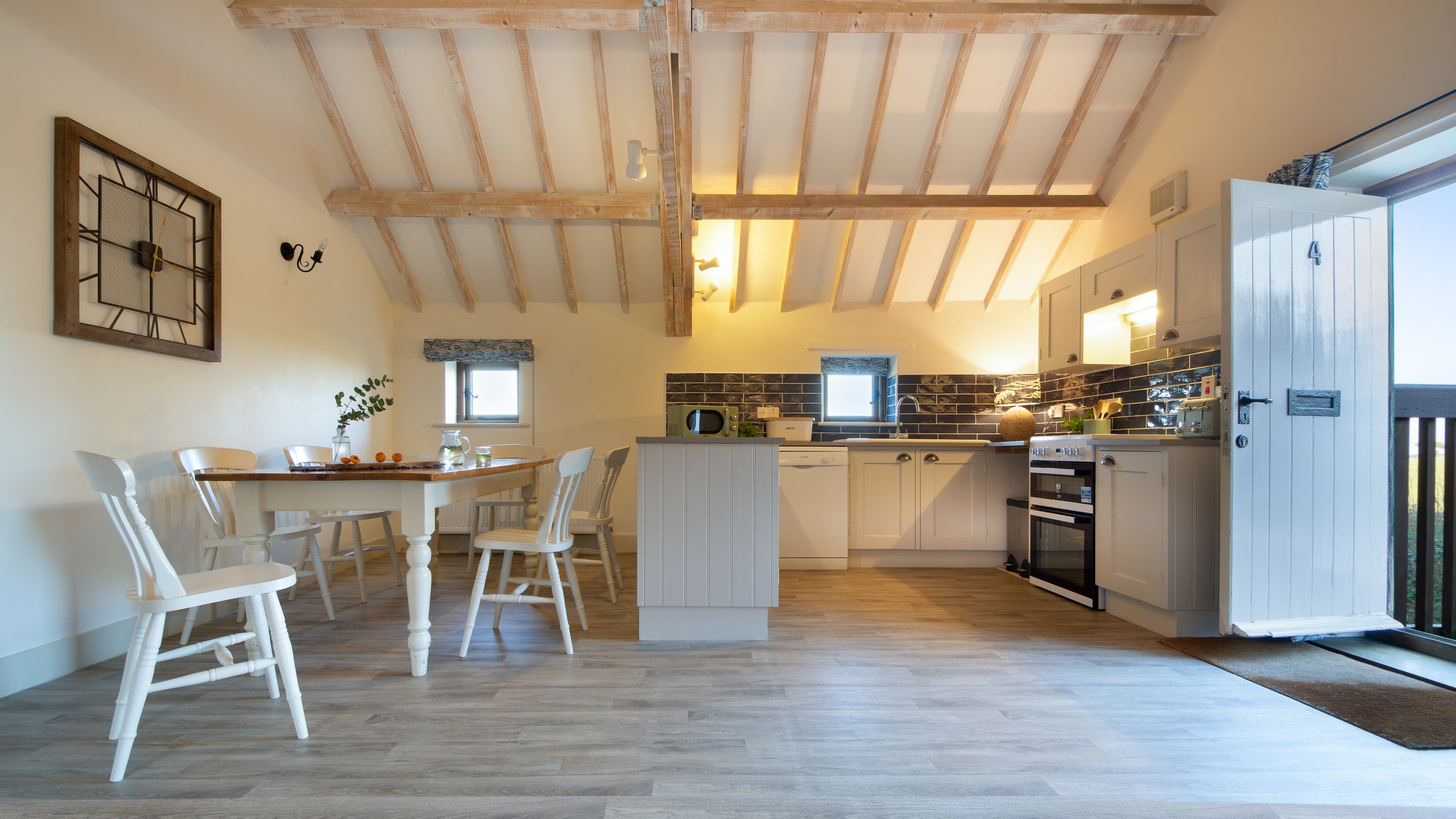 The open-plan kitchen, dining and sitting room at 4 Cart Lodge Barn, Norfolk