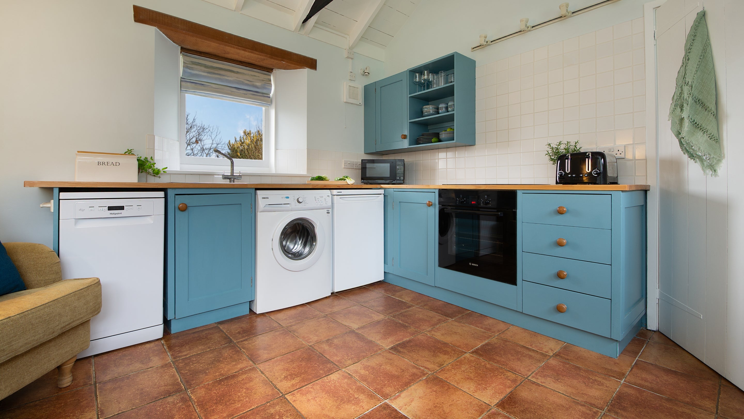 The kitchen area in the open-plan living space at Blakeney Lodge, Norfolk