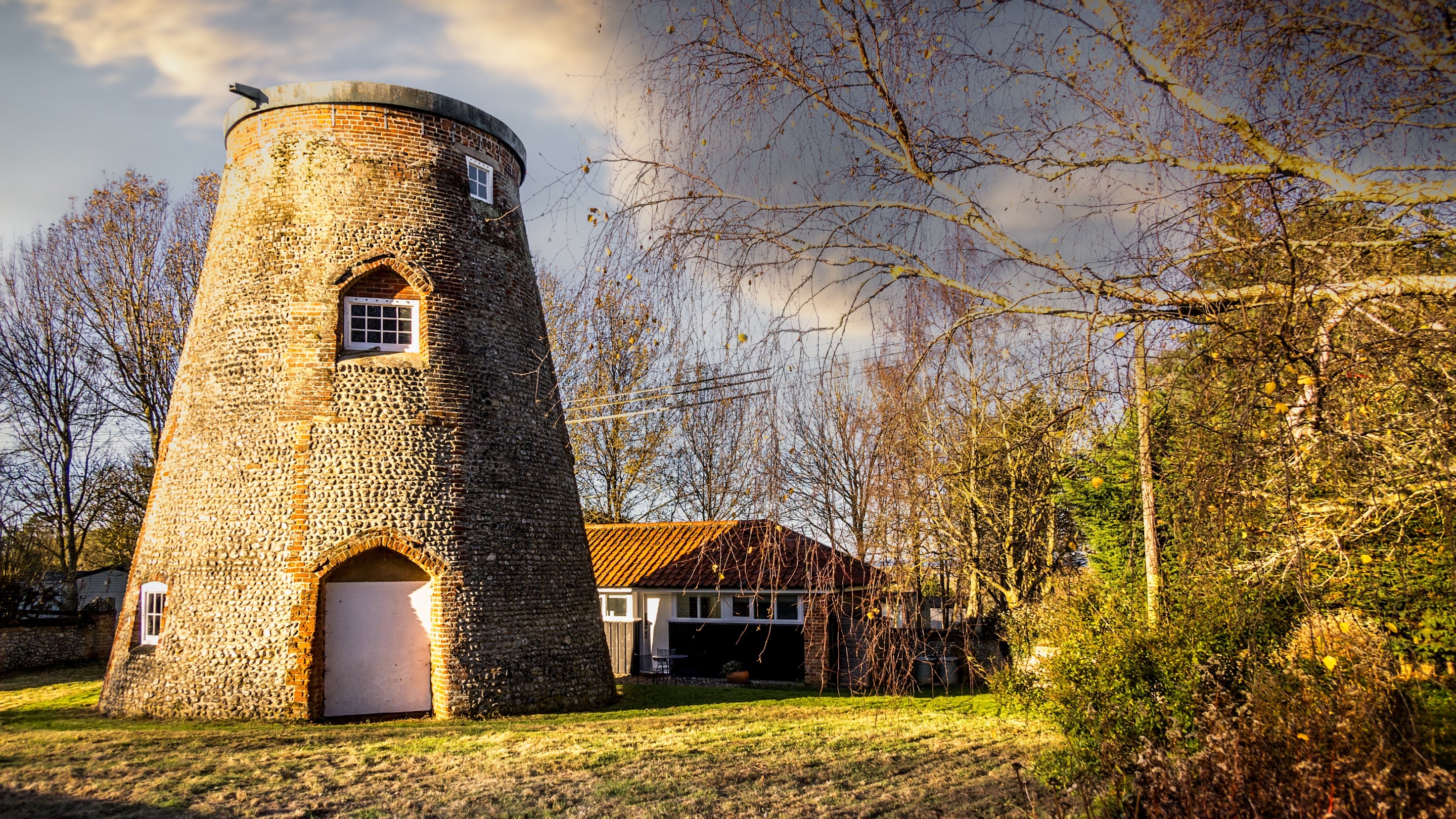 The Old Mill on the lawn in front of Blakeney Lodge, Norfolk