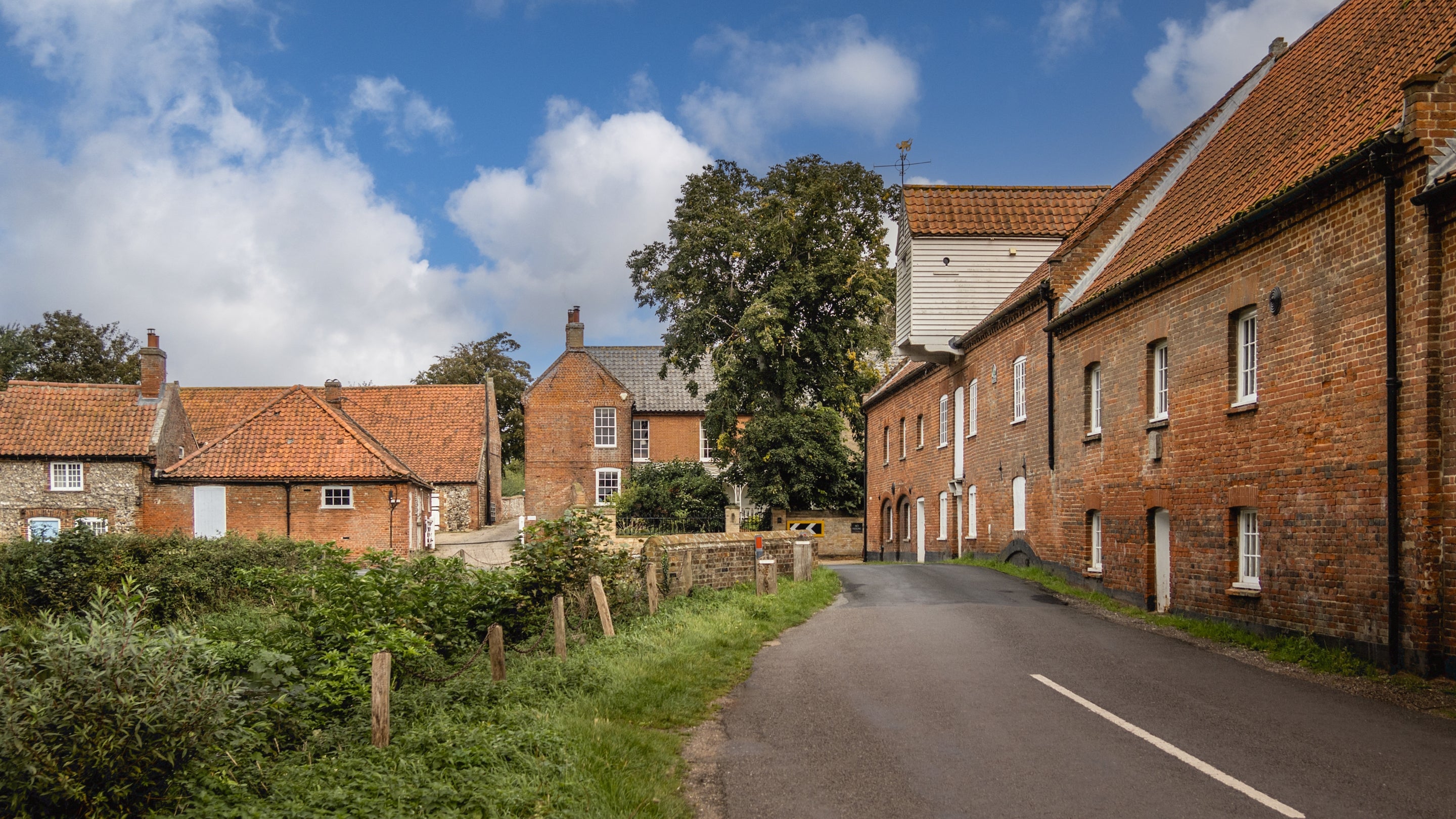 The converted watermill overlooking the mill pool at Millstream, Norfolk