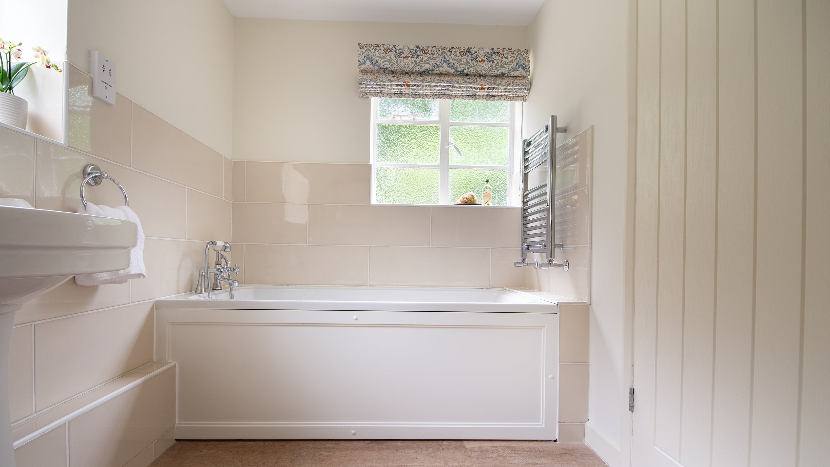 The bath in the bathroom at Mustard Pot Cottage, Norfolk