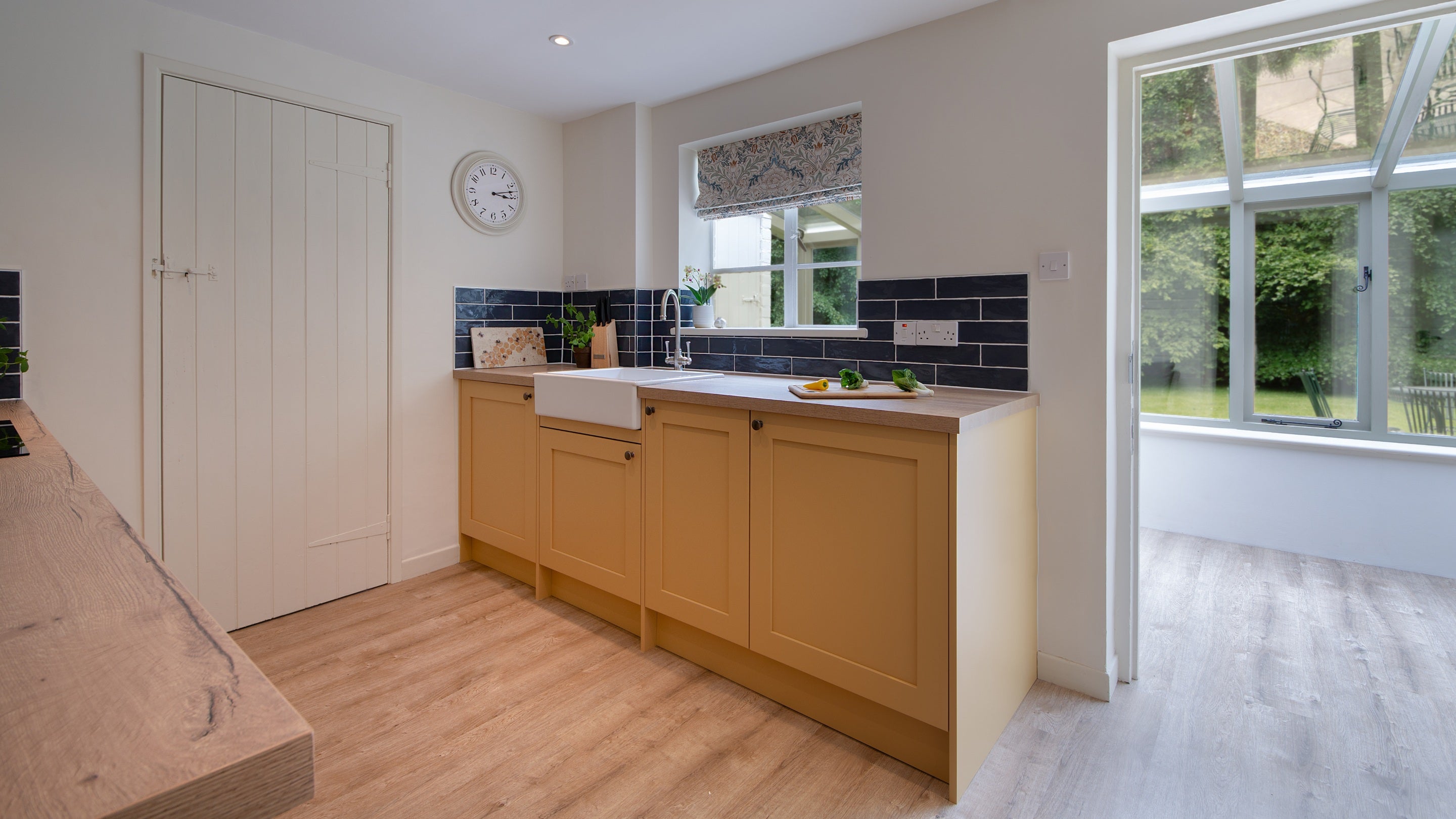 The kitchen at Mustard Pot Cottage, leading into the conservatory, Norfolk