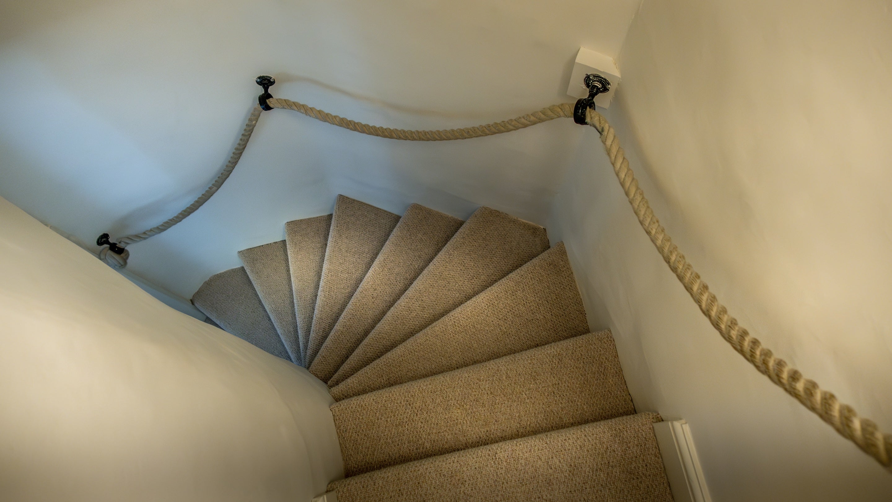 The staircase up to the reading room on the first floor of Mustard Pot Cottage, Norfolk