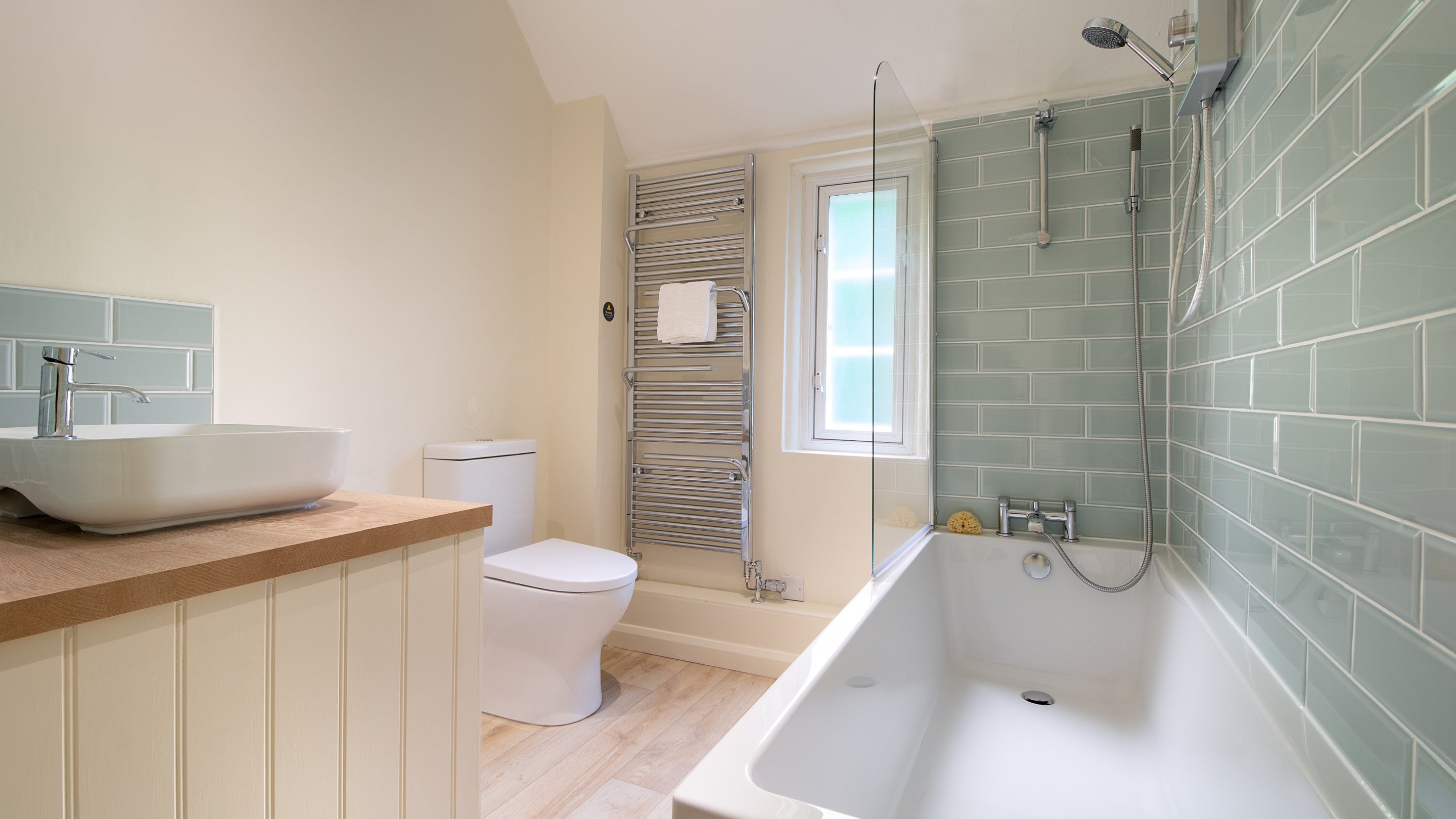 The bathroom, with shower over bath, at Sexton's Lodge, Norfolk