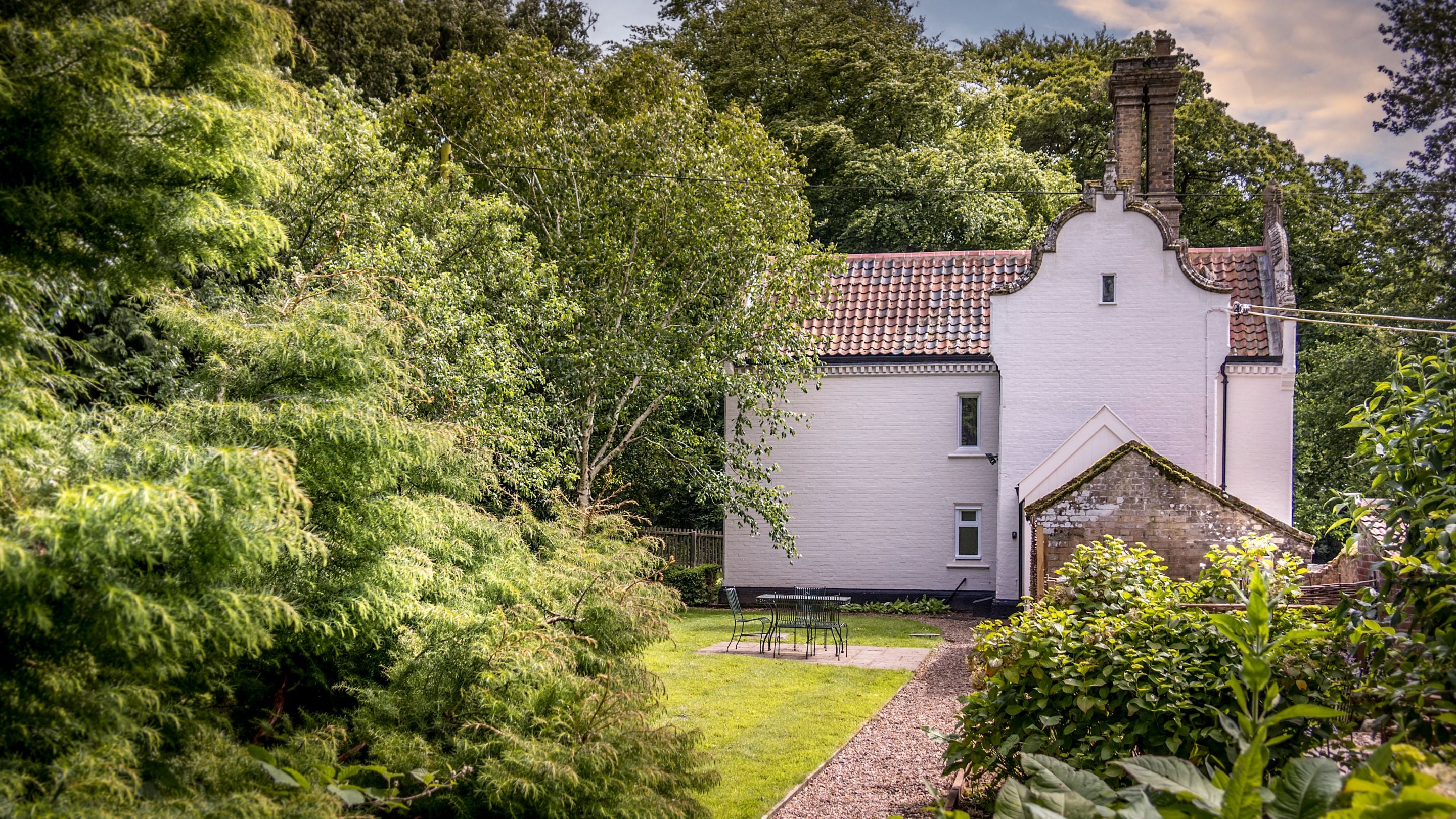 Sexton's Lodge and its lawned garden, Norfolk