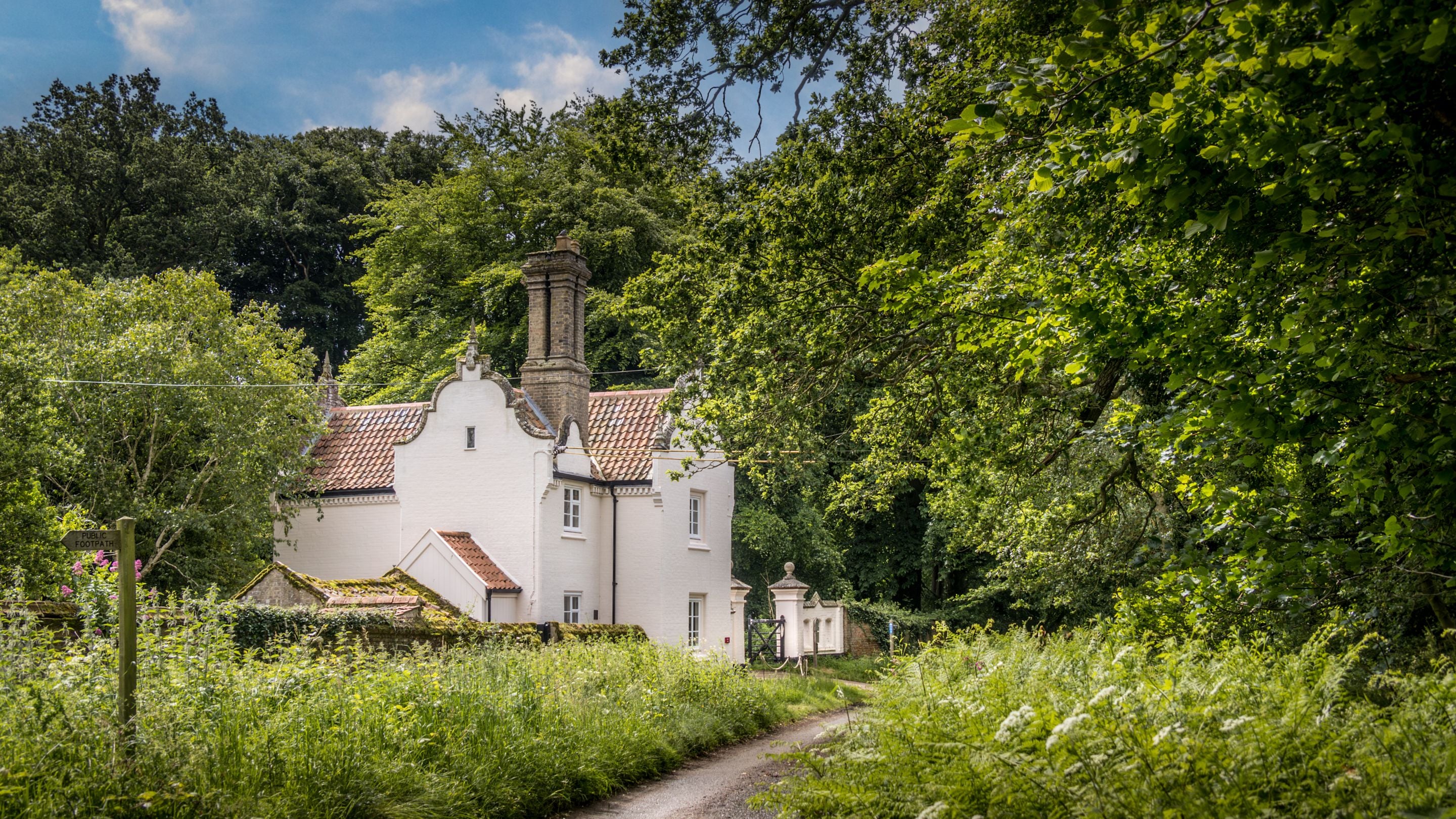 The exterior of Sexton's Lodge from the passing footpath, Norfolk