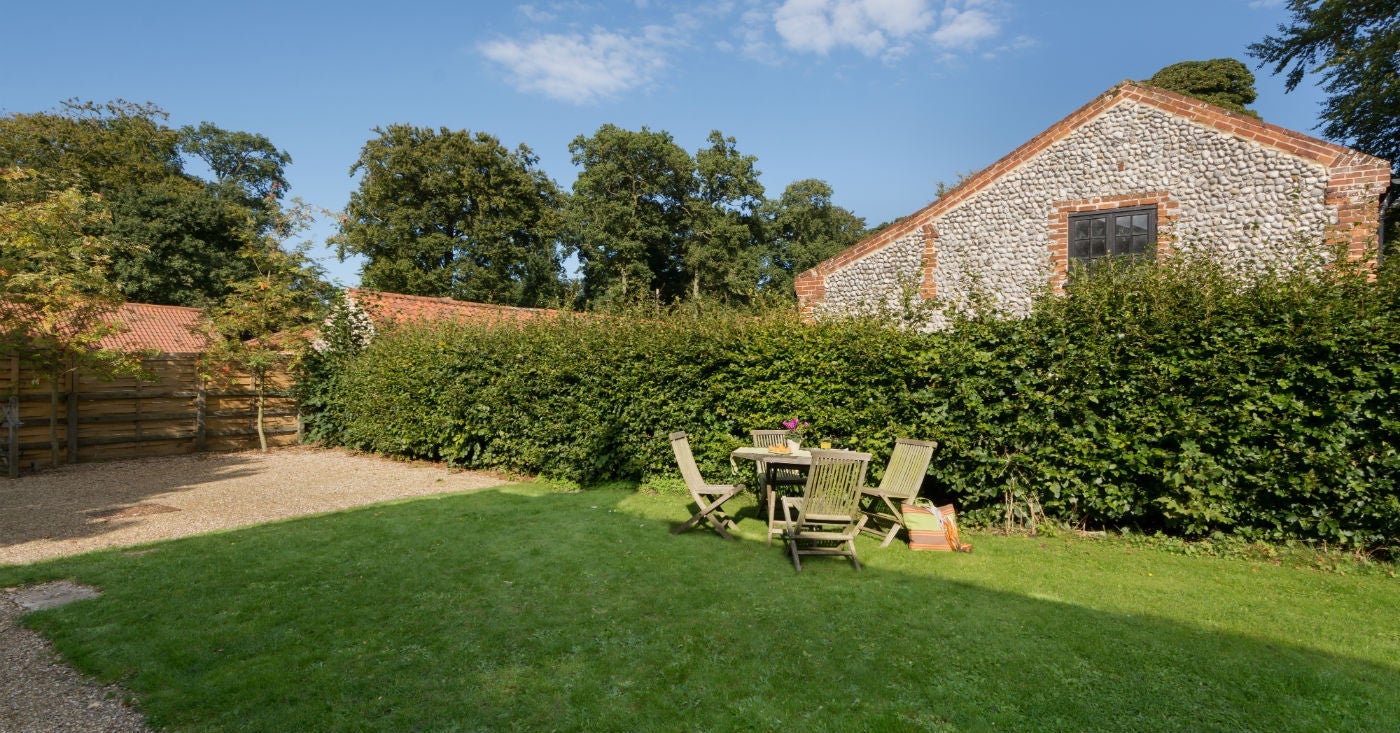 The large garden and seating area at Wood Farm, Upper Sheringham, Norfolk