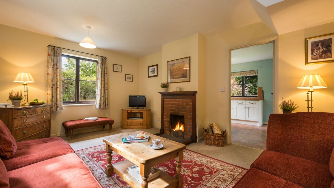 The cosy sitting room at Wood Farm, Upper Sheringham, Norfolk