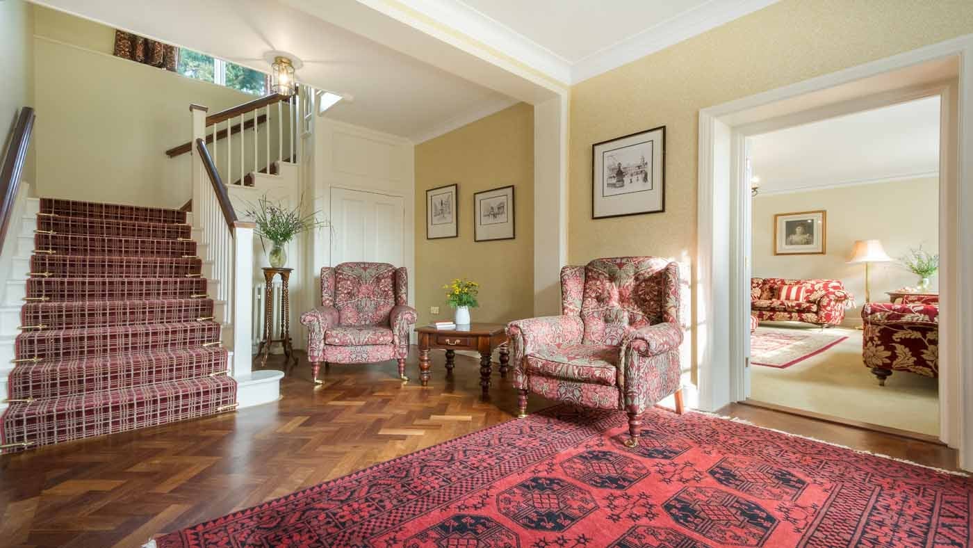 The hall and stairway at The Squire's Retreat, Cromer, Norfolk